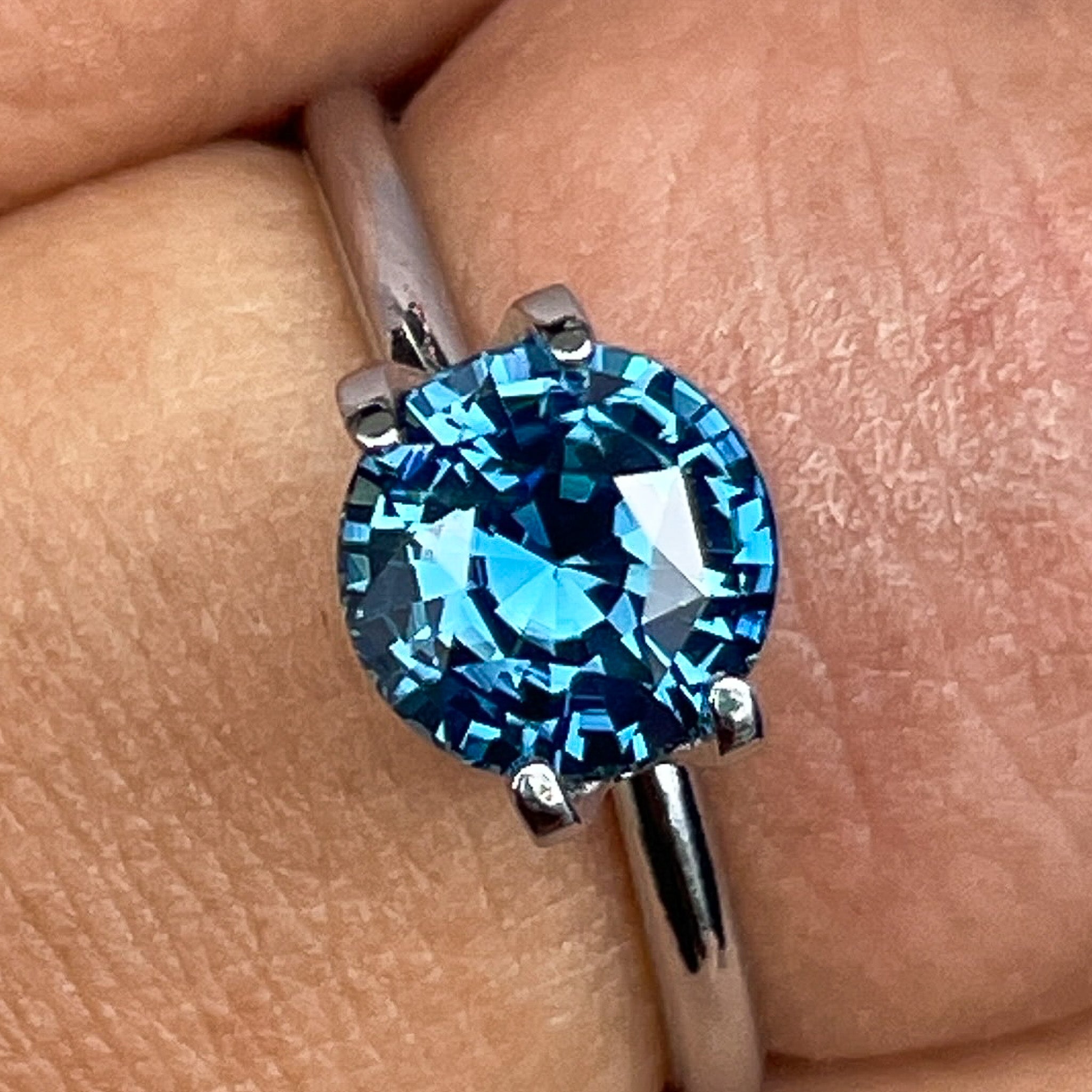 Natural teal blue sapphire, 2.10 Ct round cut loose gemstone by NASHGEMS, ideal for engagement rings or custom jewelry.