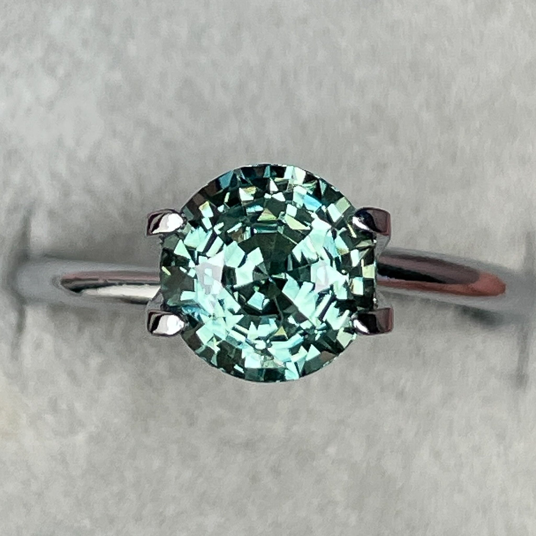 Natural green teal sapphire, 2.50 Ct round cut loose gemstone by NASHGEMS, ideal for engagement rings or custom jewelry.