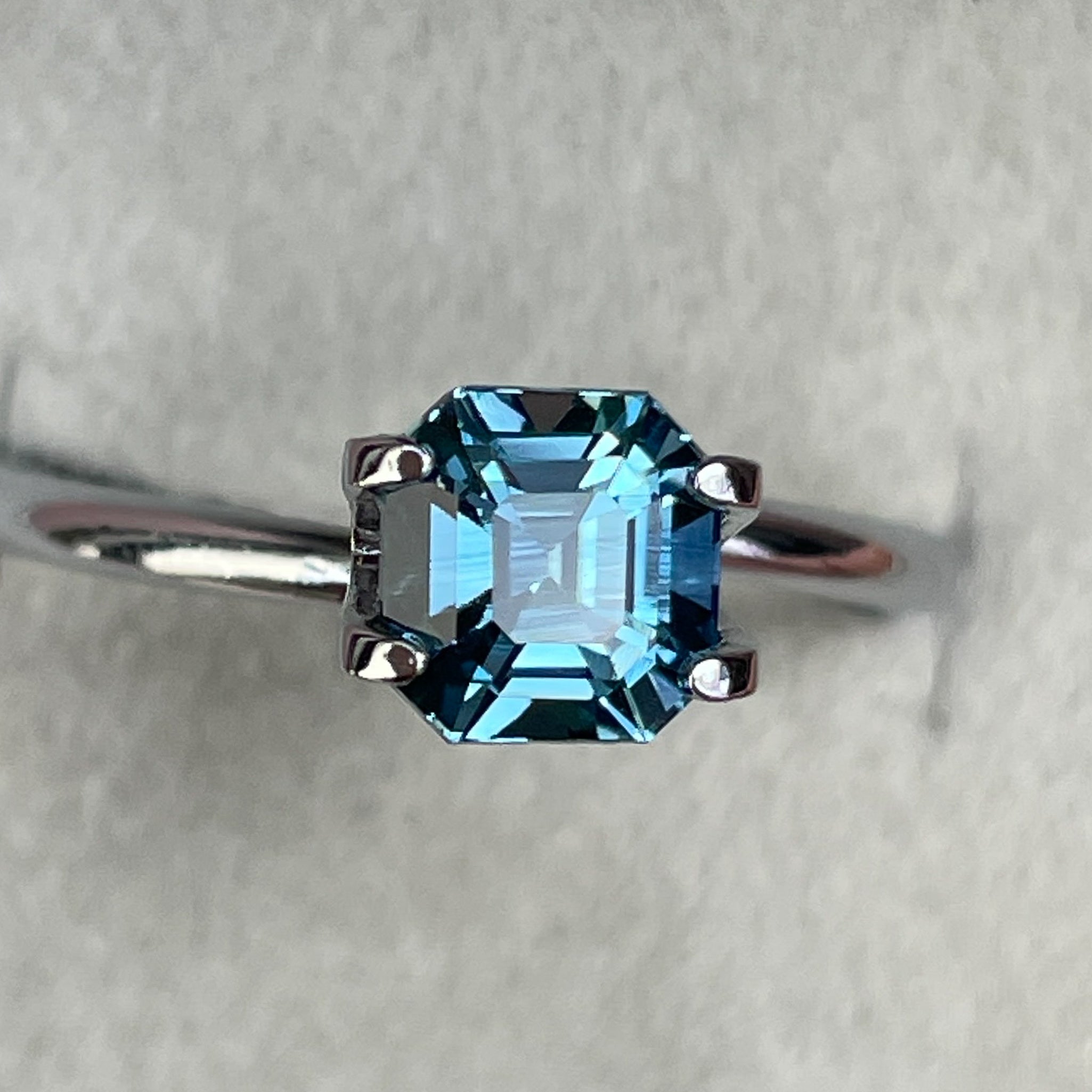 Natural teal sapphire 1.76 Ct Asscher octagon cut from NASHGEMS, heat treated loose gemstone for engagement or custom jewelry.