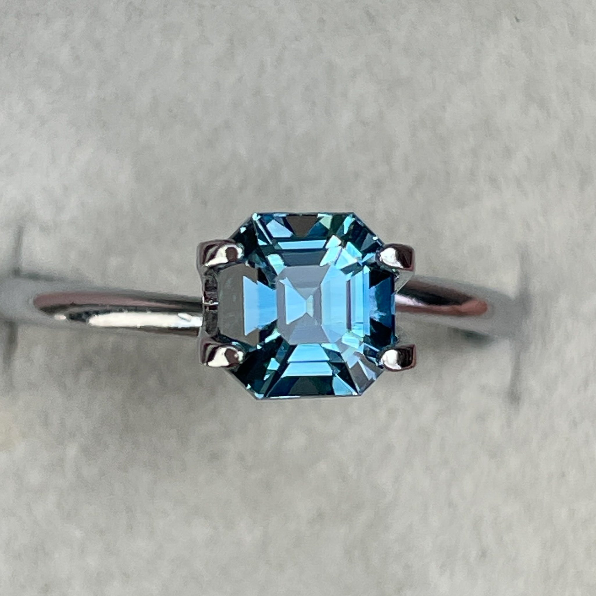 Natural teal sapphire, 1.76 Ct Asscher octagon cut, heat-treated loose gemstone by NASHGEMS for engagement or custom jewelry.