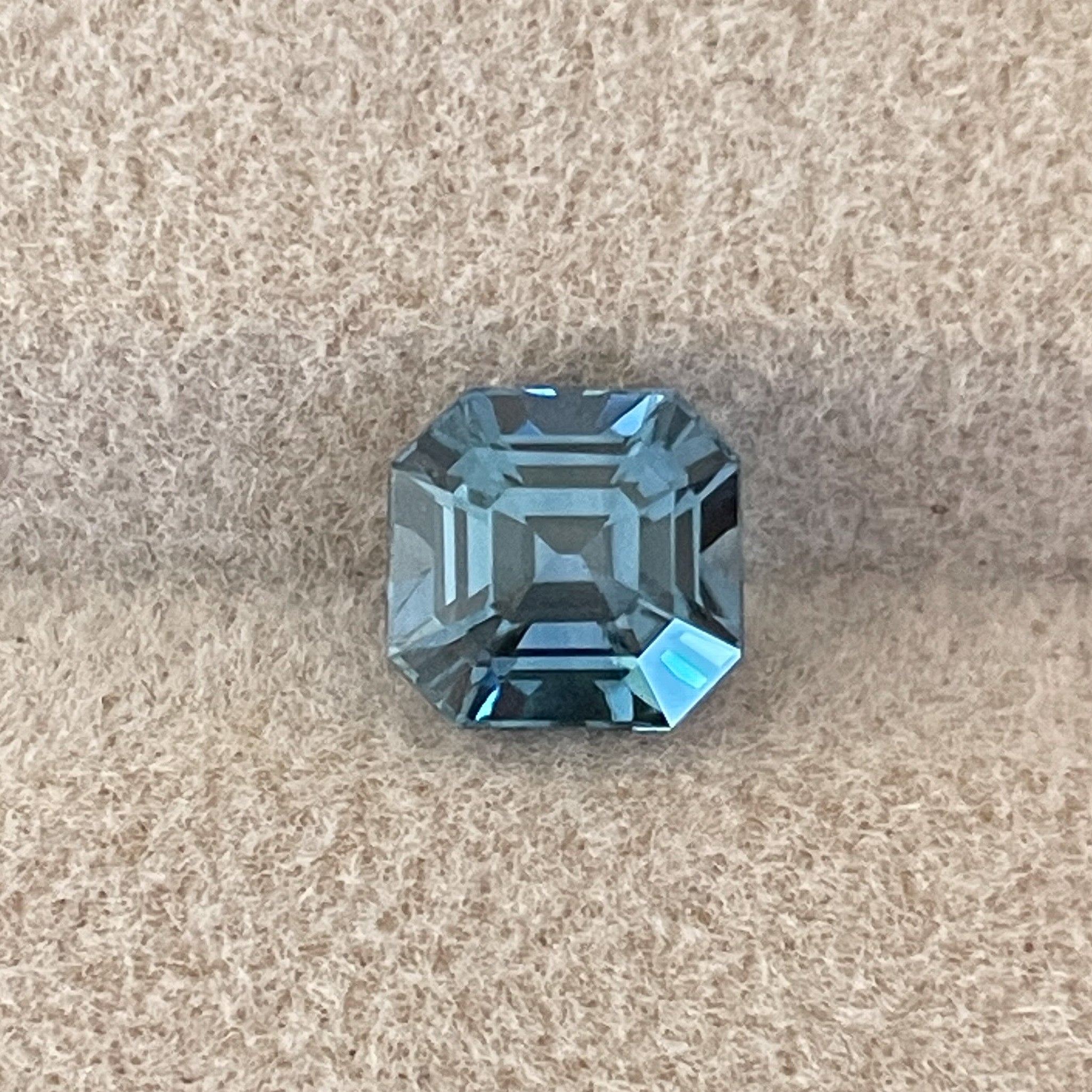 Natural teal sapphire 1.76 Ct Asscher octagon cut, heat-treated loose gemstone ideal for engagement rings or custom jewelry.