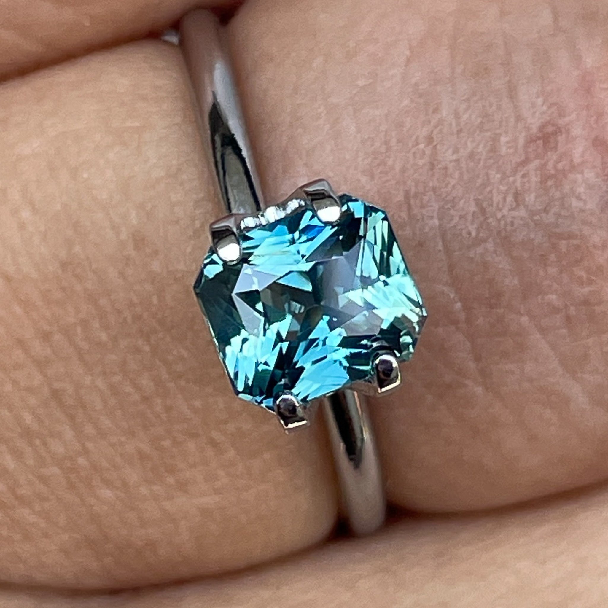 Natural teal sapphire by NASHGEMS, 1.73 ct radiant cut loose gemstone ideal for engagement rings or custom jewelry.
