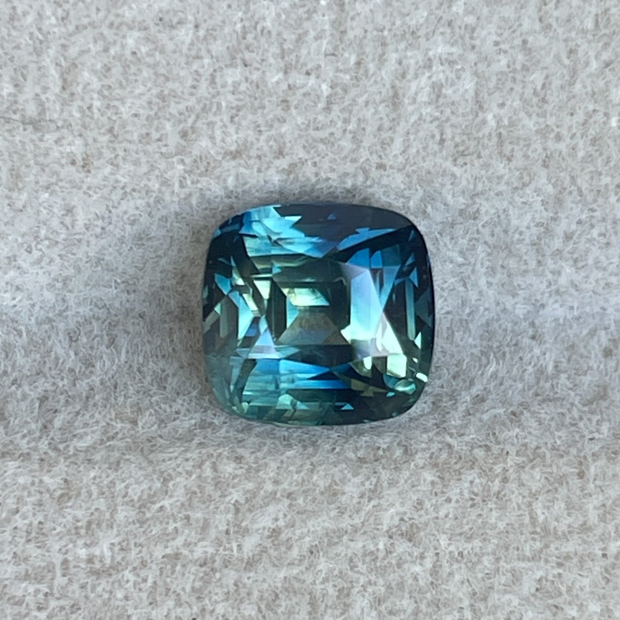 Natural blue-green cushion cut sapphire by NASHGEMS, 2.14 Ct teal loose sapphire for jewelry or engagement ring designs.