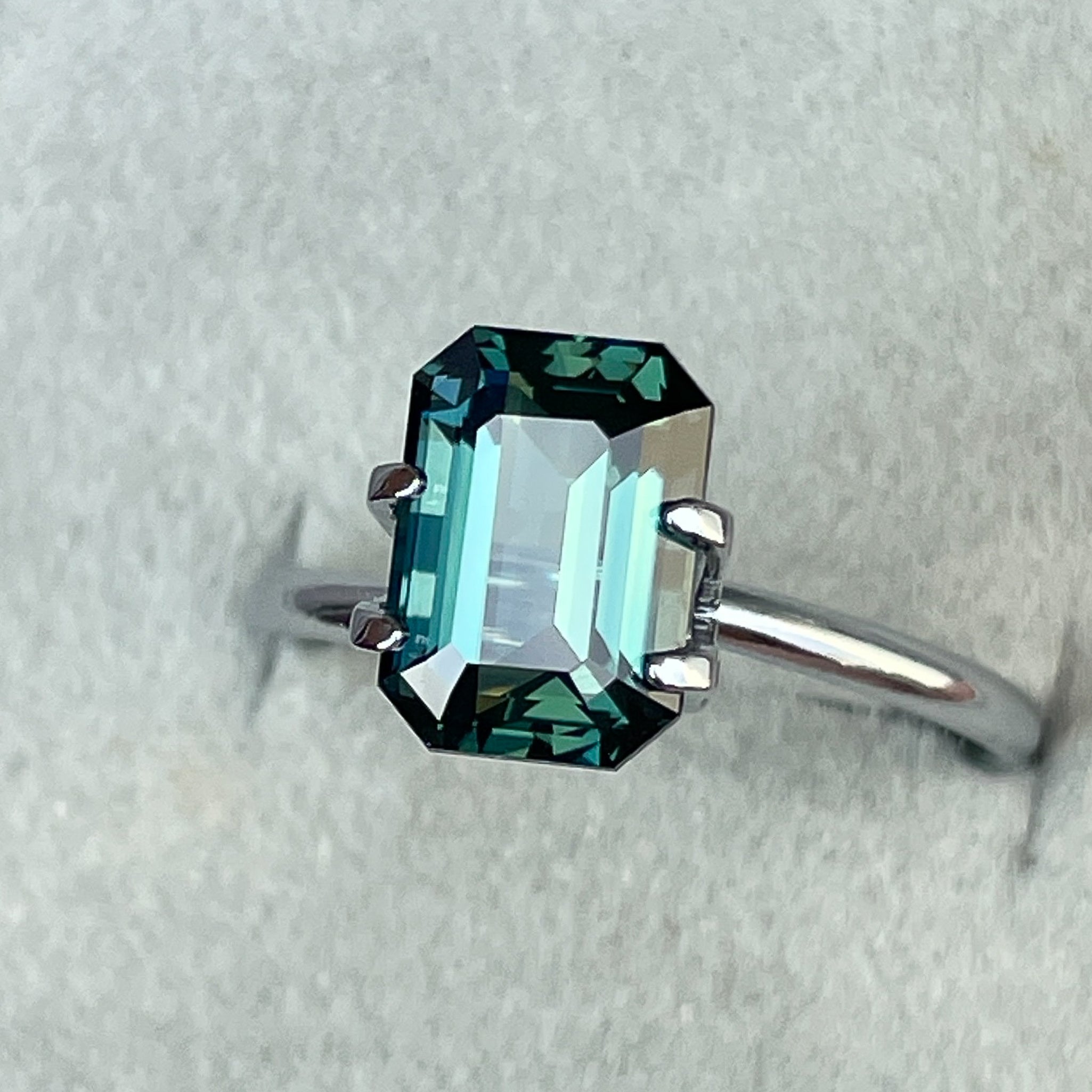Natural teal blue green sapphire, 3.71 Ct emerald cut loose gemstone by NASHGEMS, ideal for engagement rings or custom jewelry.