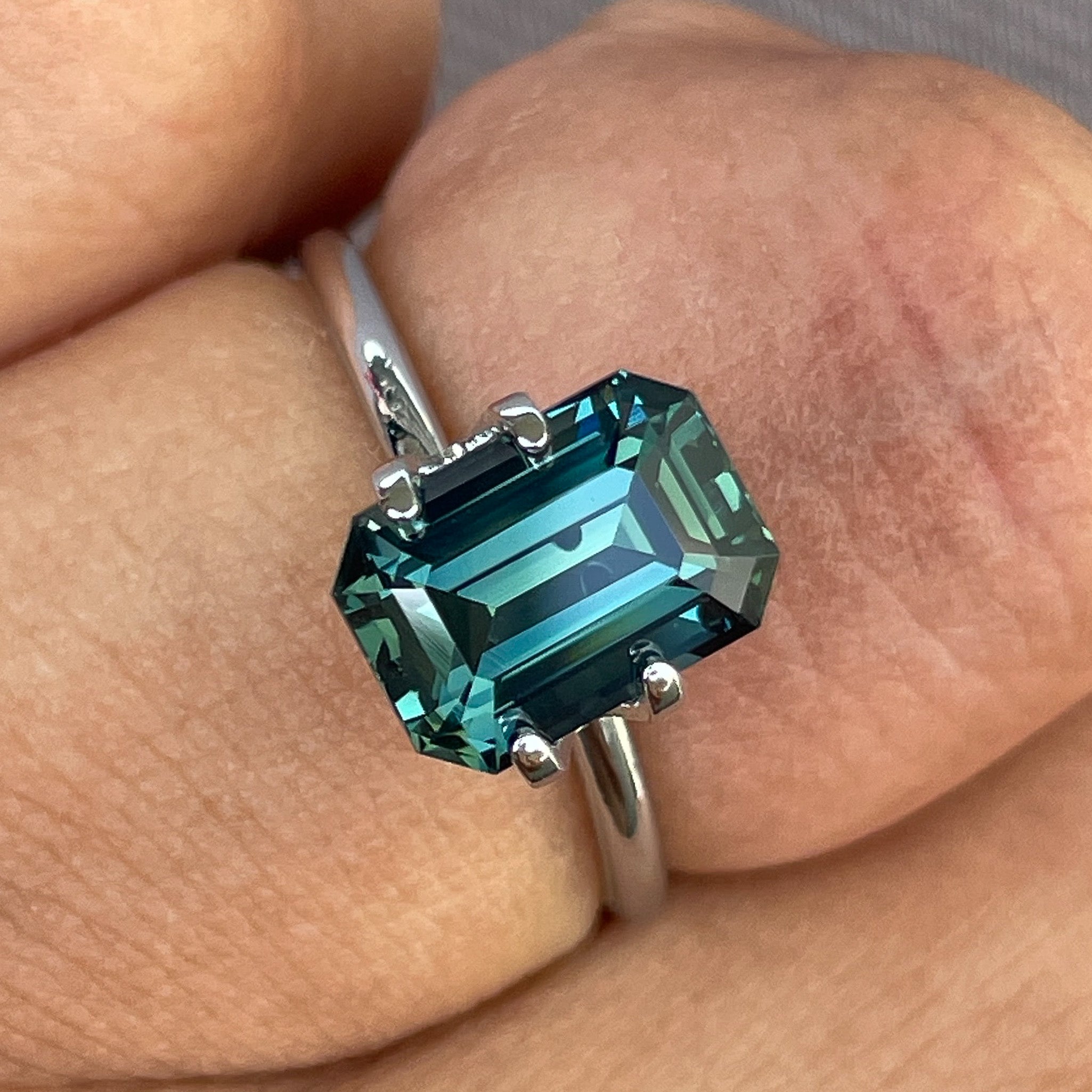 Natural teal blue-green sapphire 3.71 carats in emerald cut by NASHGEMS, loose gemstone suitable for jewelry and engagement rings.
