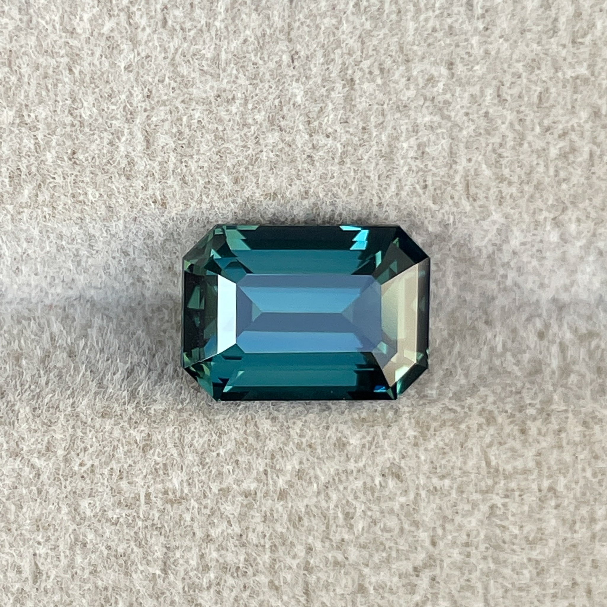 Natural teal blue-green sapphire, 3.71 Ct emerald cut loose gemstone from NASHGEMS, ideal for engagement rings or custom jewelry.