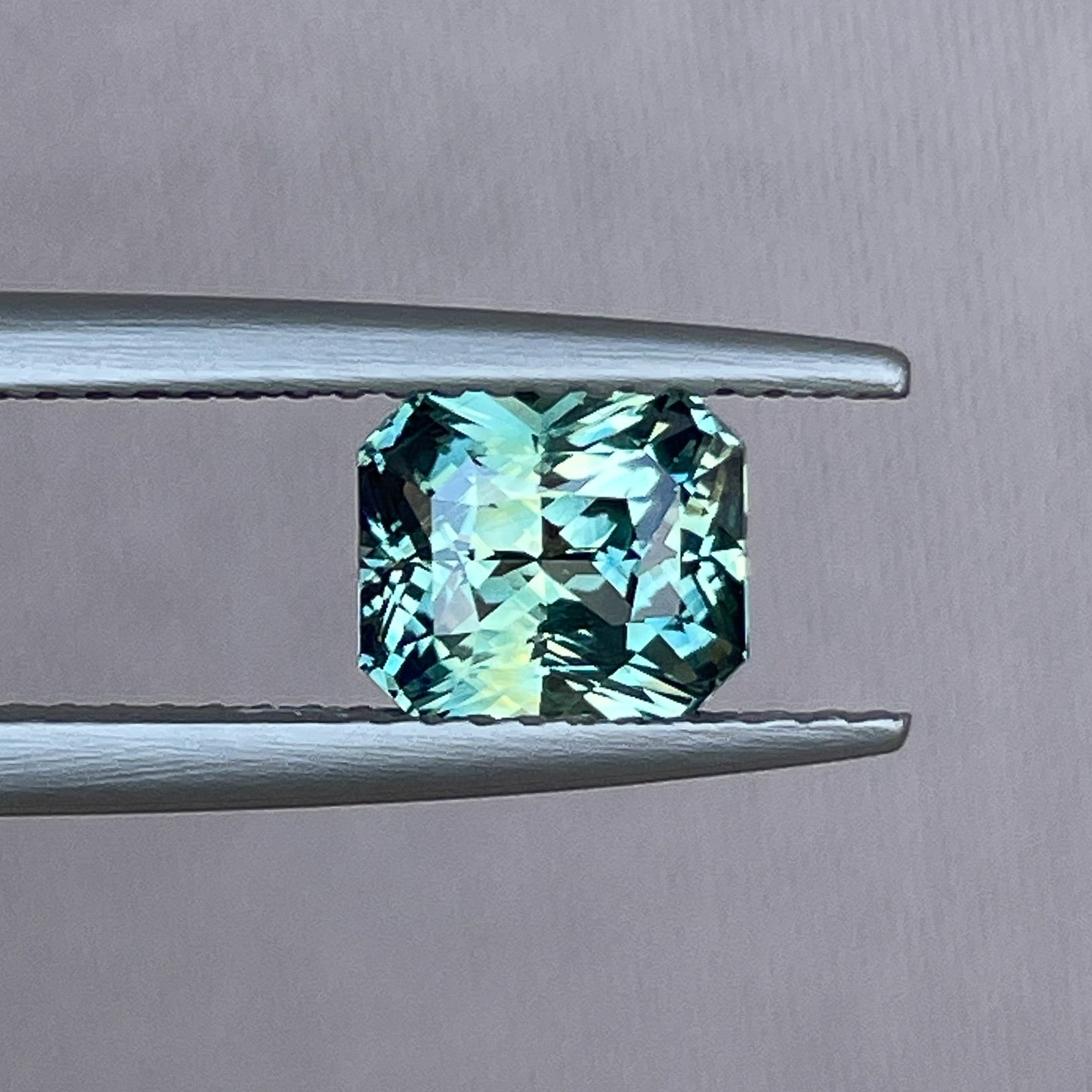Teal sapphire loose gemstone in radiant cut, 1.65 Ct, no heat, from NASHGEMS, ideal for engagement rings or jewelry design.