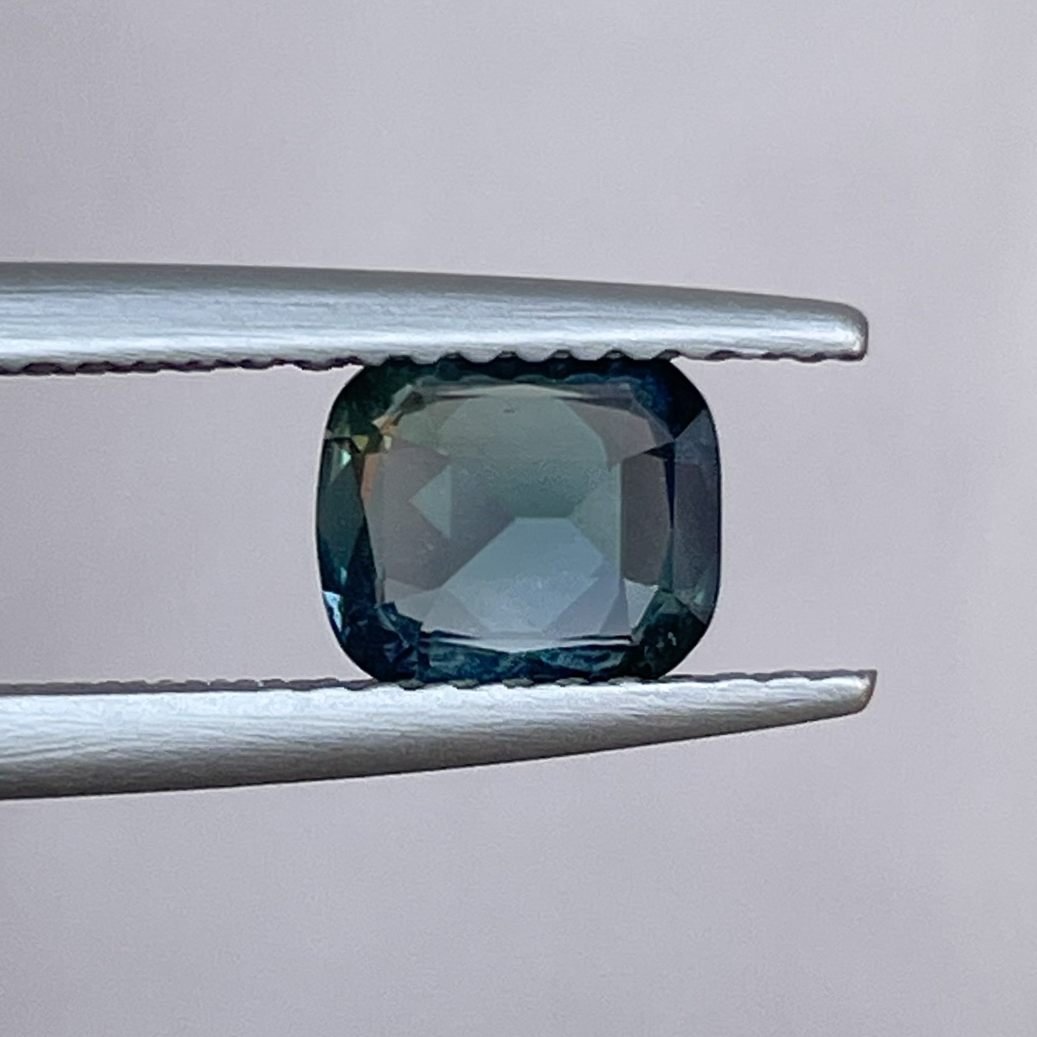 Natural teal blue sapphire 1.18 Ct cushion cut loose gemstone from NASHGEMS, ideal for engagement rings or custom jewelry.