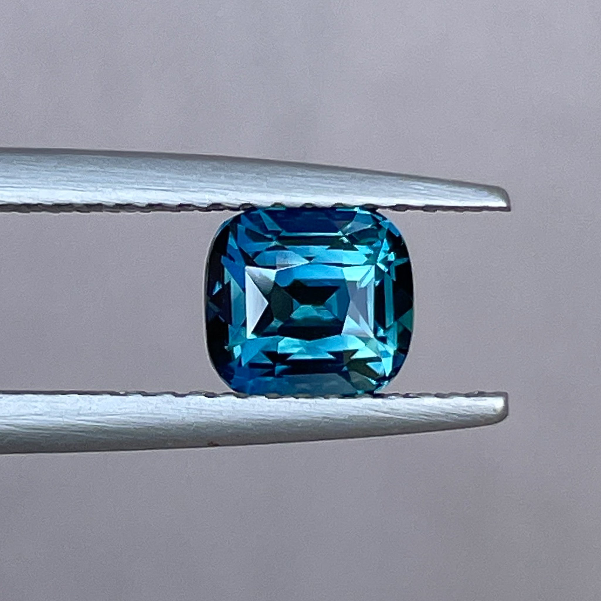 Teal blue sapphire loose gemstone, 1.52 carats, cushion cut, natural and no heat, ideal for engagement rings or custom jewelry.