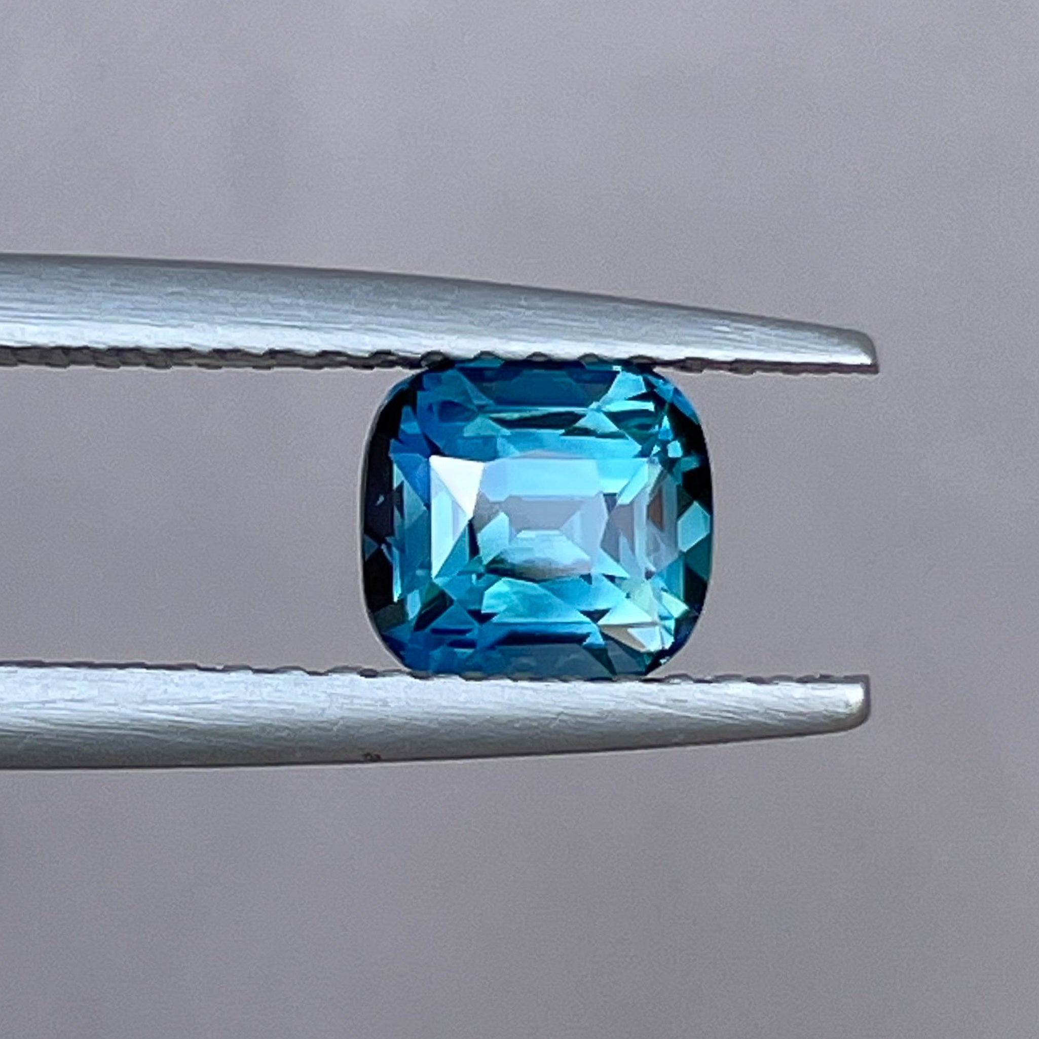 Natural teal blue sapphire loose gemstone, 1.52 Ct cushion cut by NASHGEMS, ideal for engagement rings or custom jewelry.
