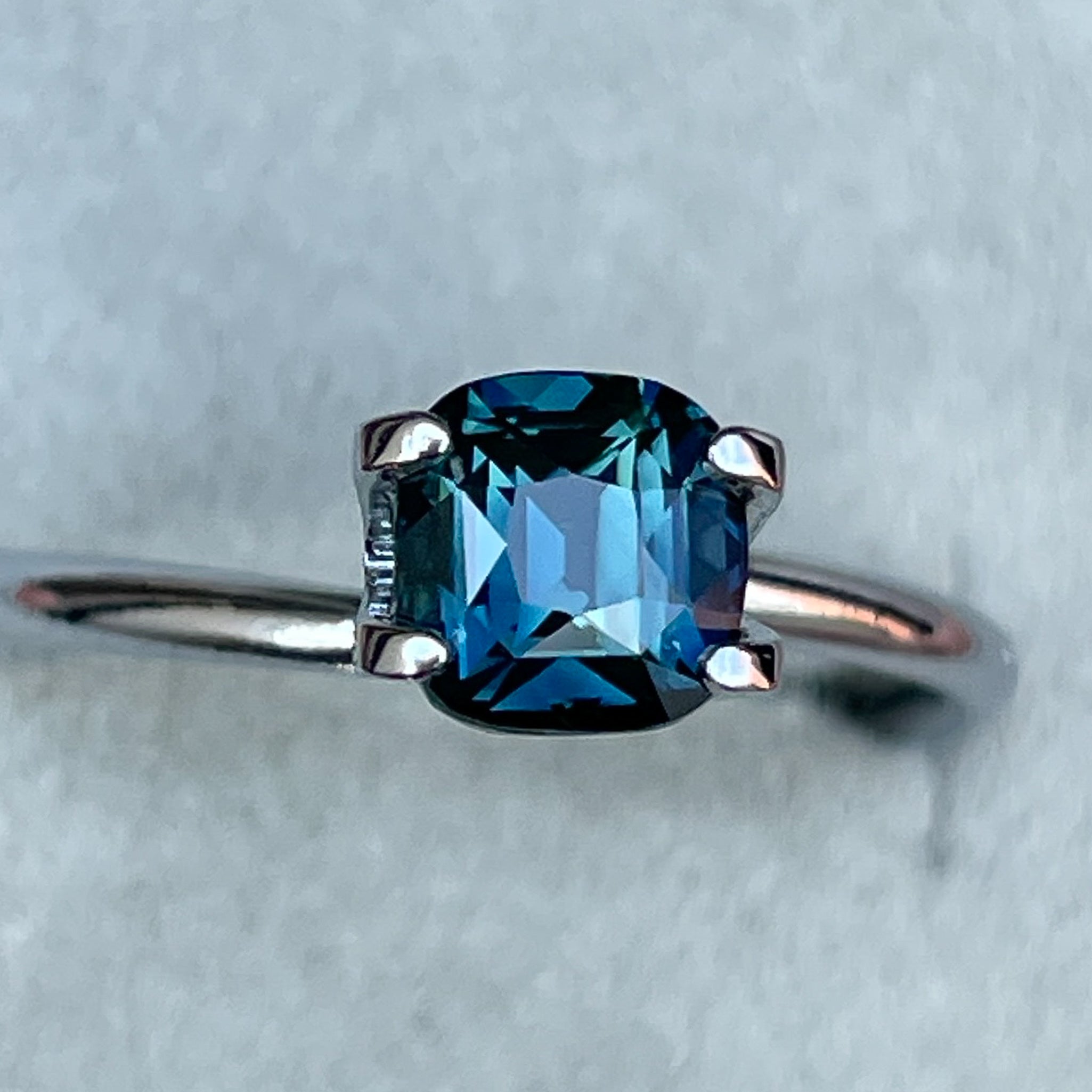 Natural teal blue sapphire 1.52 Ct cushion cut loose gemstone from NASHGEMS, ideal for engagement rings or custom jewelry.