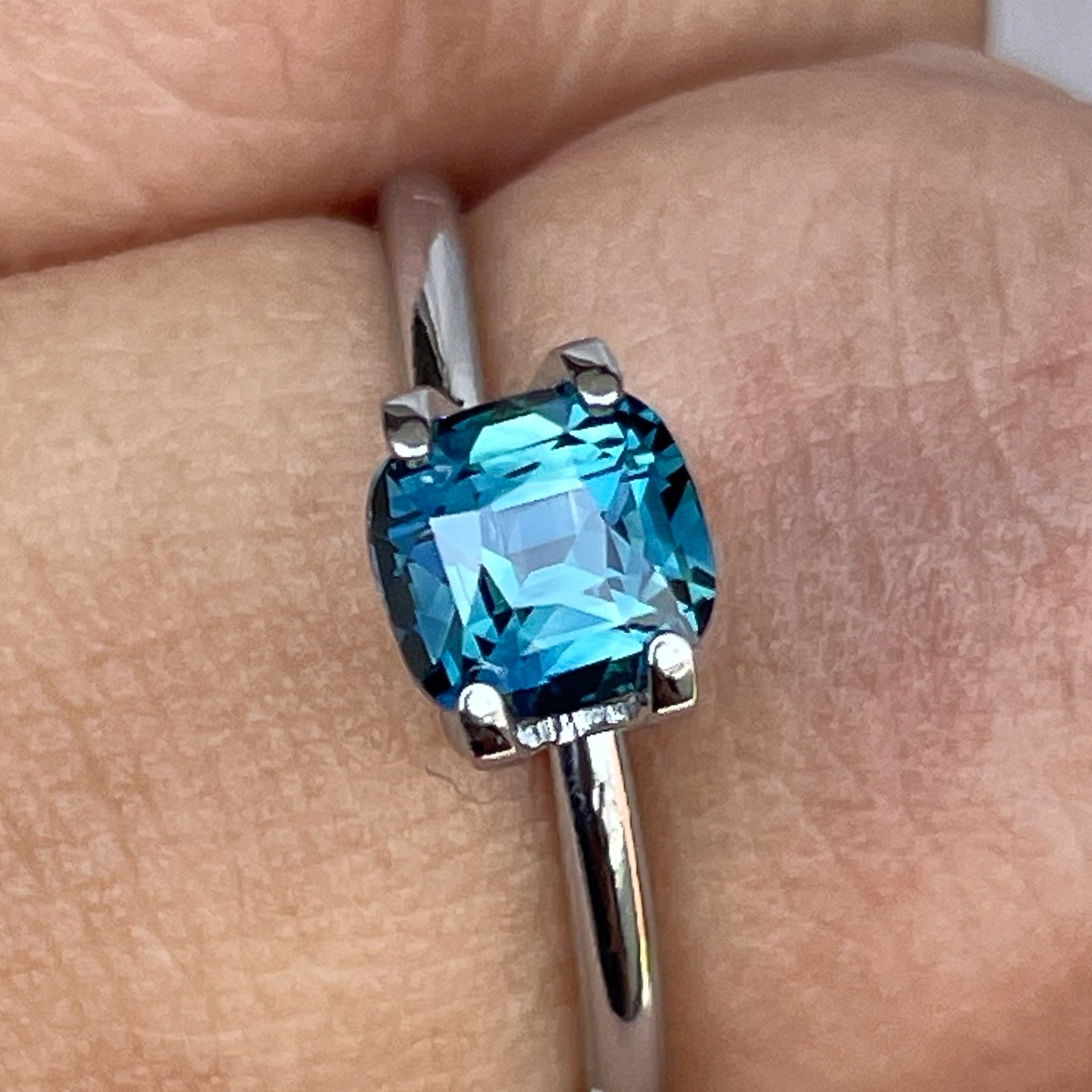 Natural teal blue sapphire 1.52 ct cushion cut loose gemstone from NASHGEMS, ideal for engagement rings or custom jewelry.