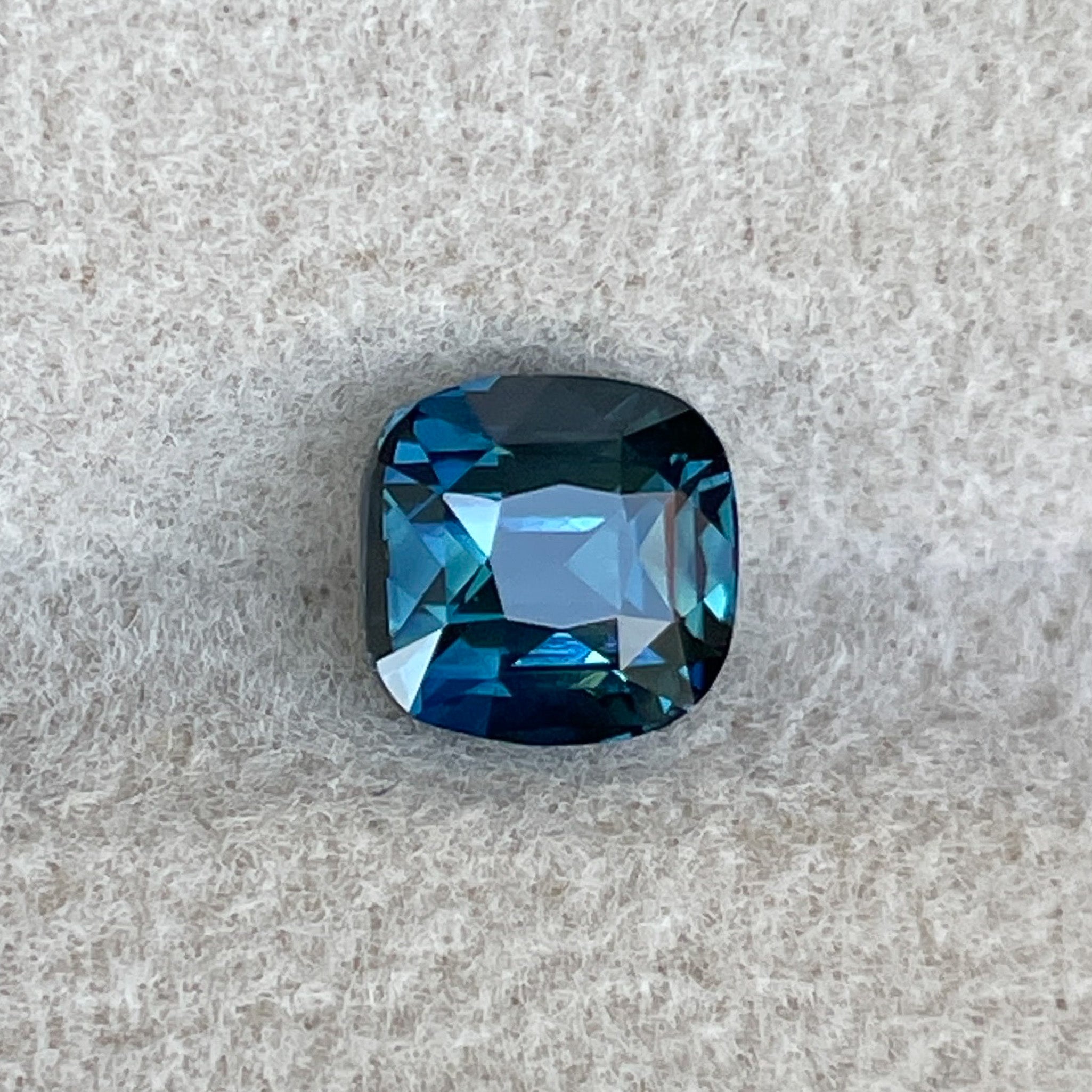 Natural teal blue sapphire loose stone, 1.52 Ct cushion cut by NASHGEMS, ideal for engagement rings or custom jewelry.