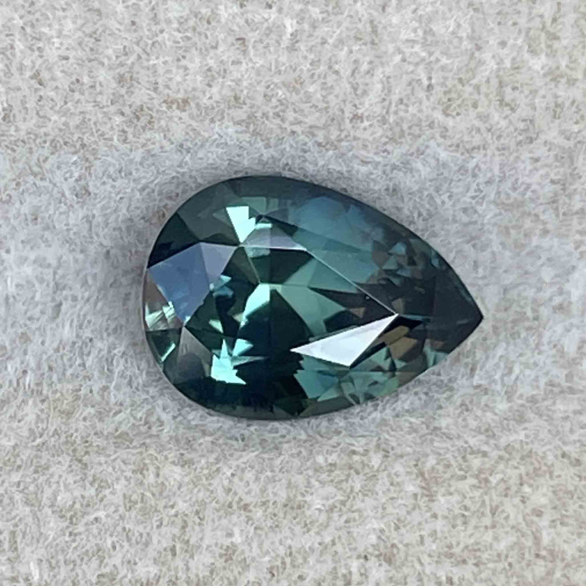 Natural teal blue green sapphire, 1.57 Ct pear-shaped loose gemstone from NASHGEMS, ideal for custom engagement rings.