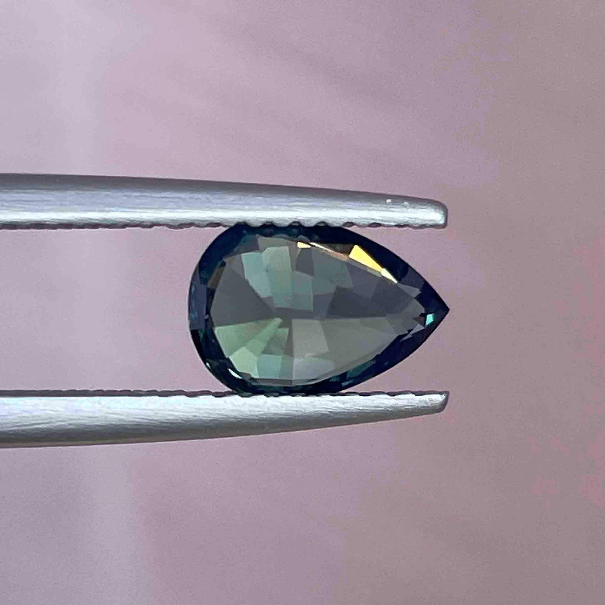 Natural teal blue green sapphire, 1.57 Ct pear-shaped loose gemstone from NASHGEMS, ideal for custom engagement rings.