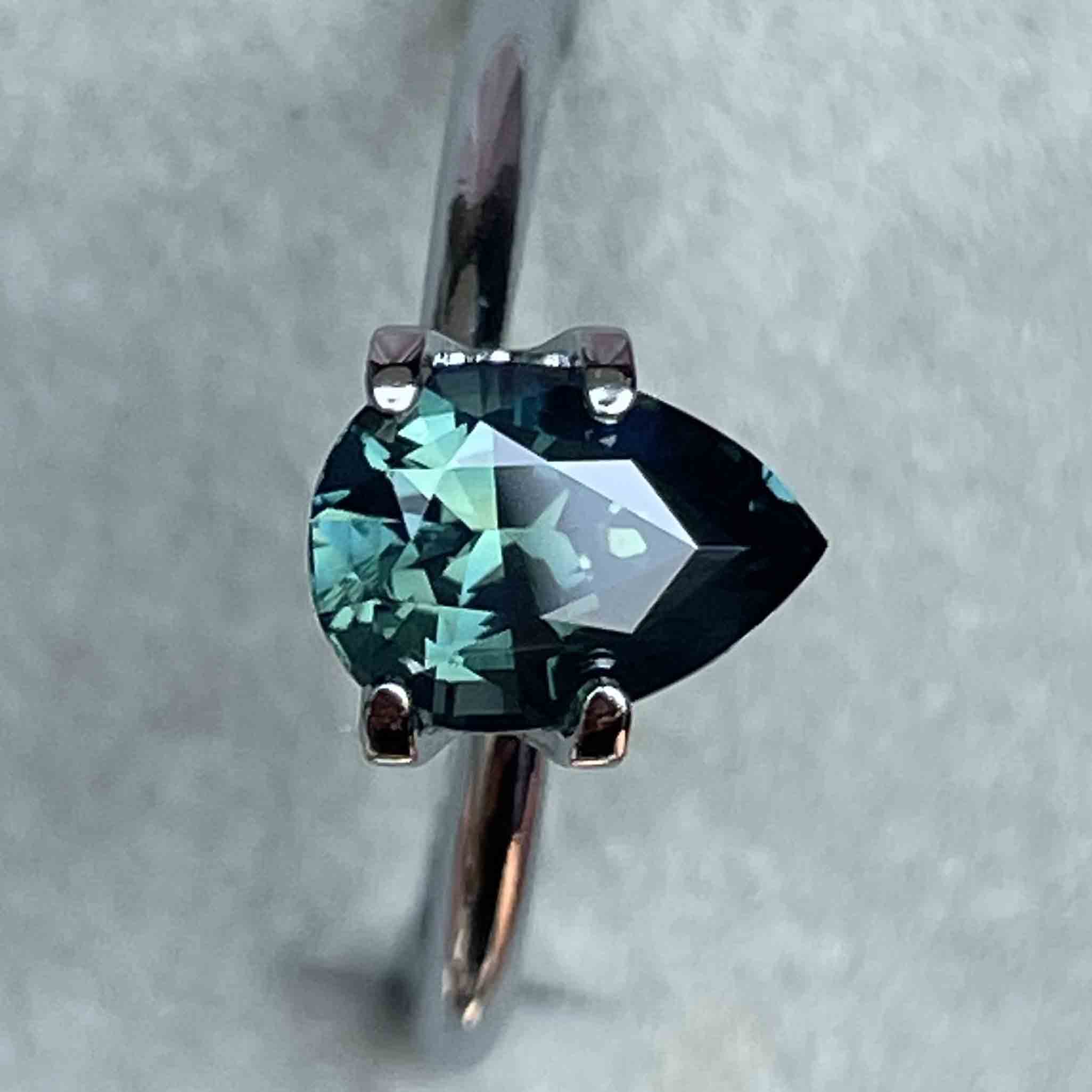Teal blue green 1.57 Ct pear-shaped loose sapphire gemstone from NASHGEMS, ideal for custom engagement rings.