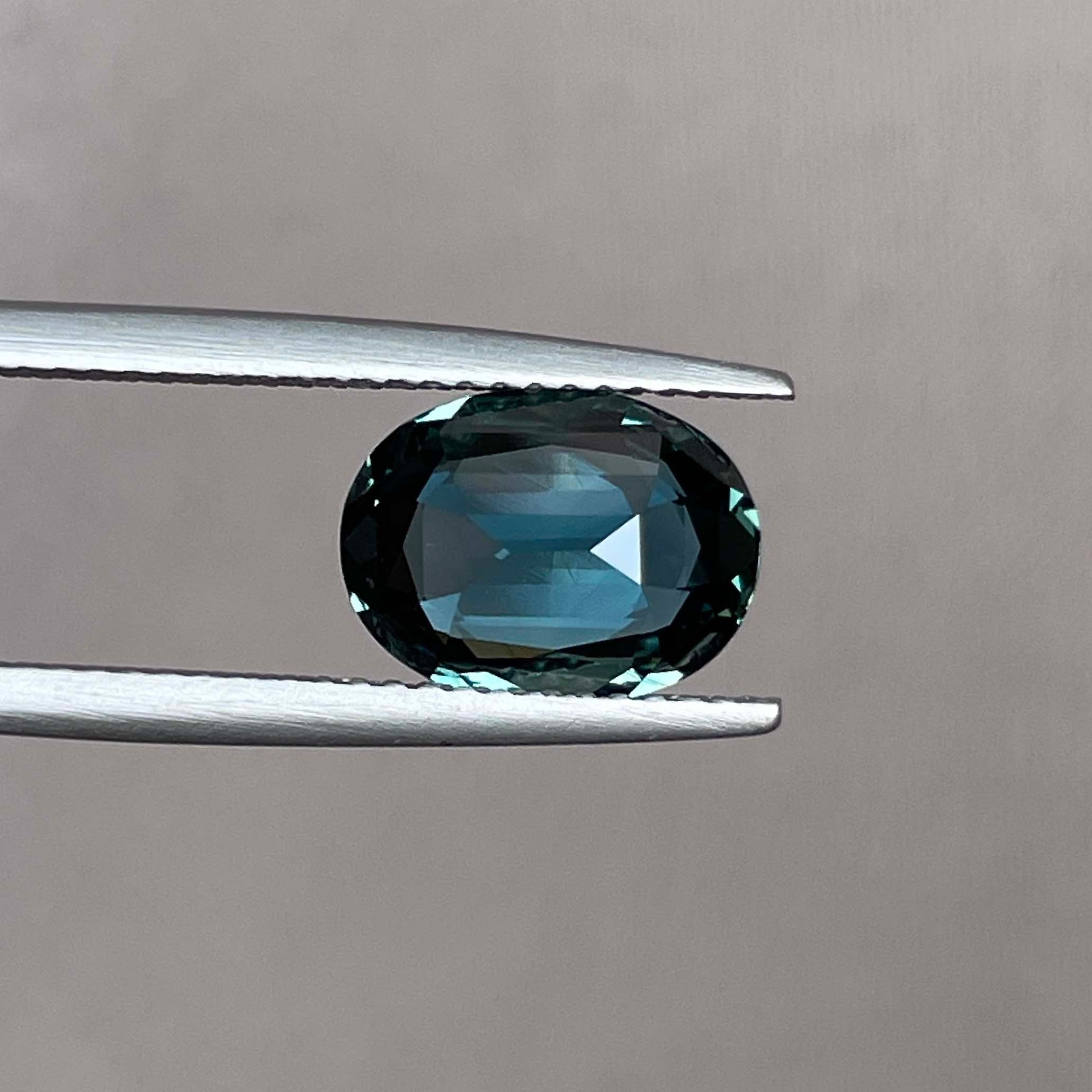 Natural teal blue green sapphire 3.19 ct oval loose gemstone from NASHGEMS, ideal for engagement rings or custom jewelry designs.