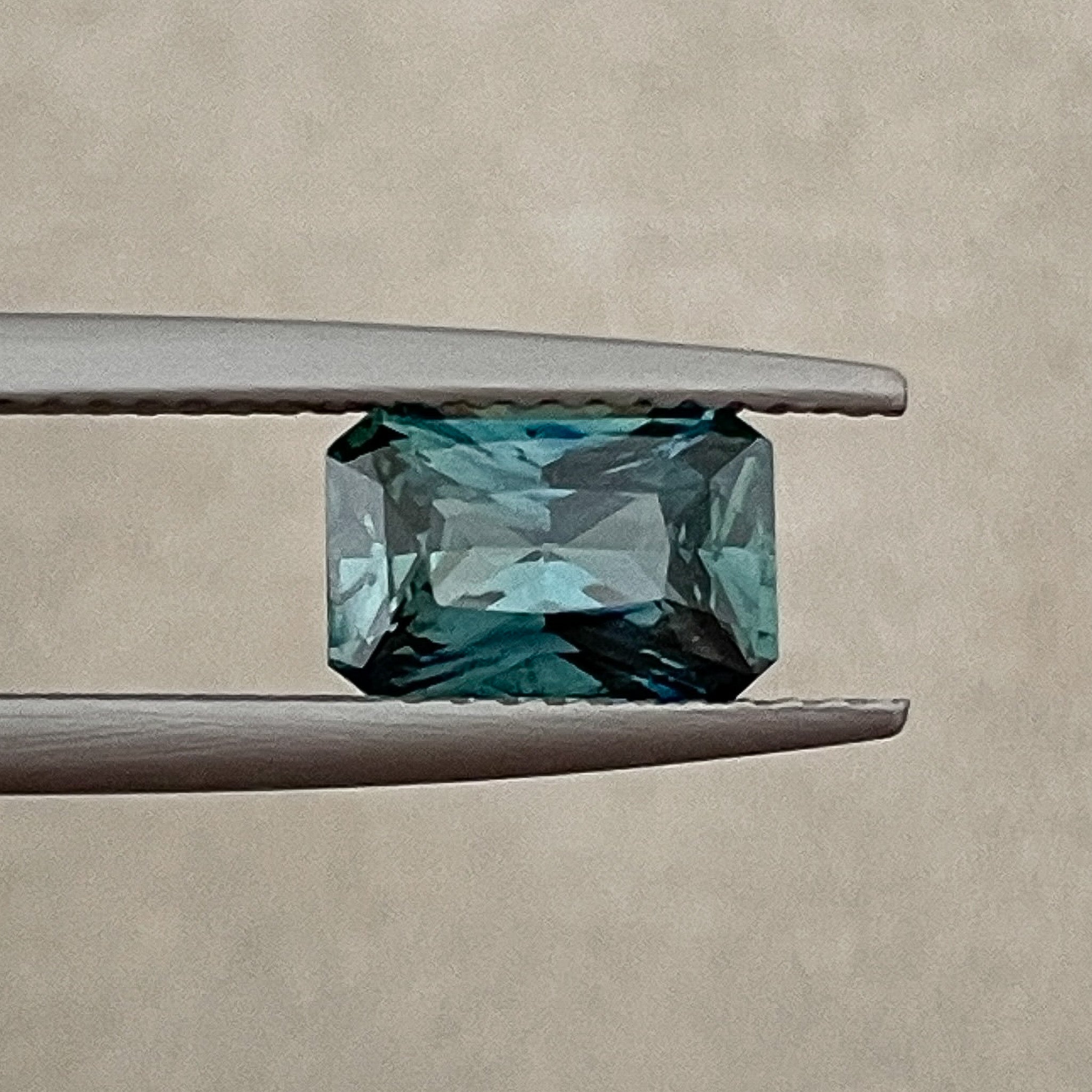 Natural teal blue-green sapphire, 1.71 ct radiant cut, loose no heat gemstone by NASHGEMS for engagement or custom jewelry.