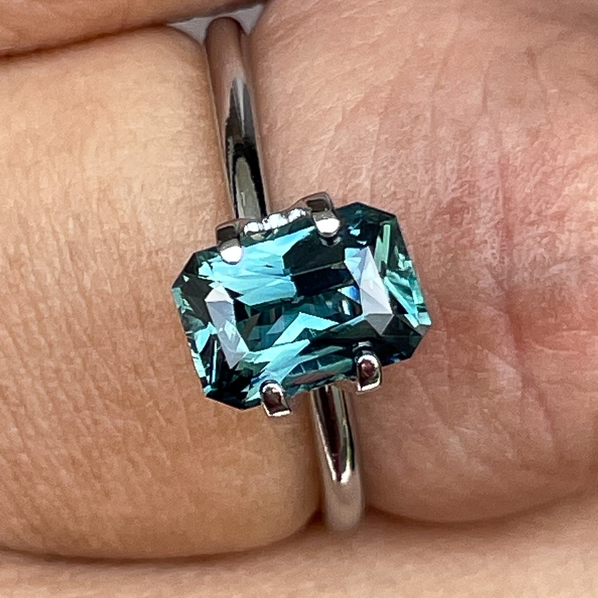 Natural teal blue-green sapphire, 1.71 carats, radiant cut, loose gemstone by NASHGEMS for engagement or custom jewelry.