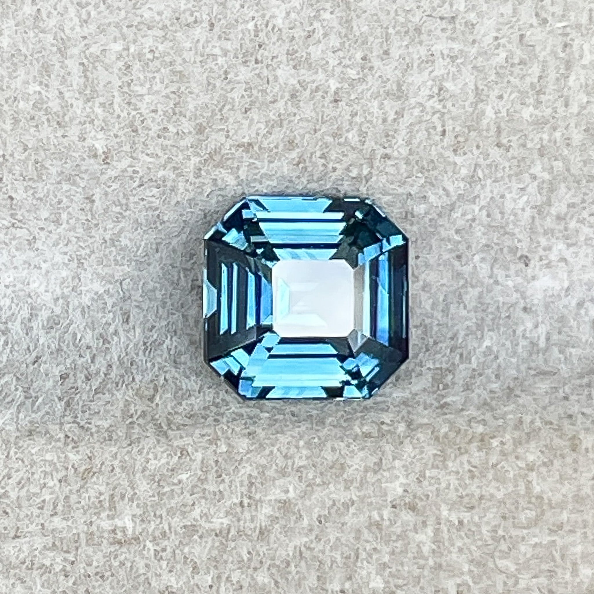 Natural teal blue sapphire 1.52 Ct emerald cut loose gemstone by NASHGEMS, ideal for engagement rings or custom jewelry.