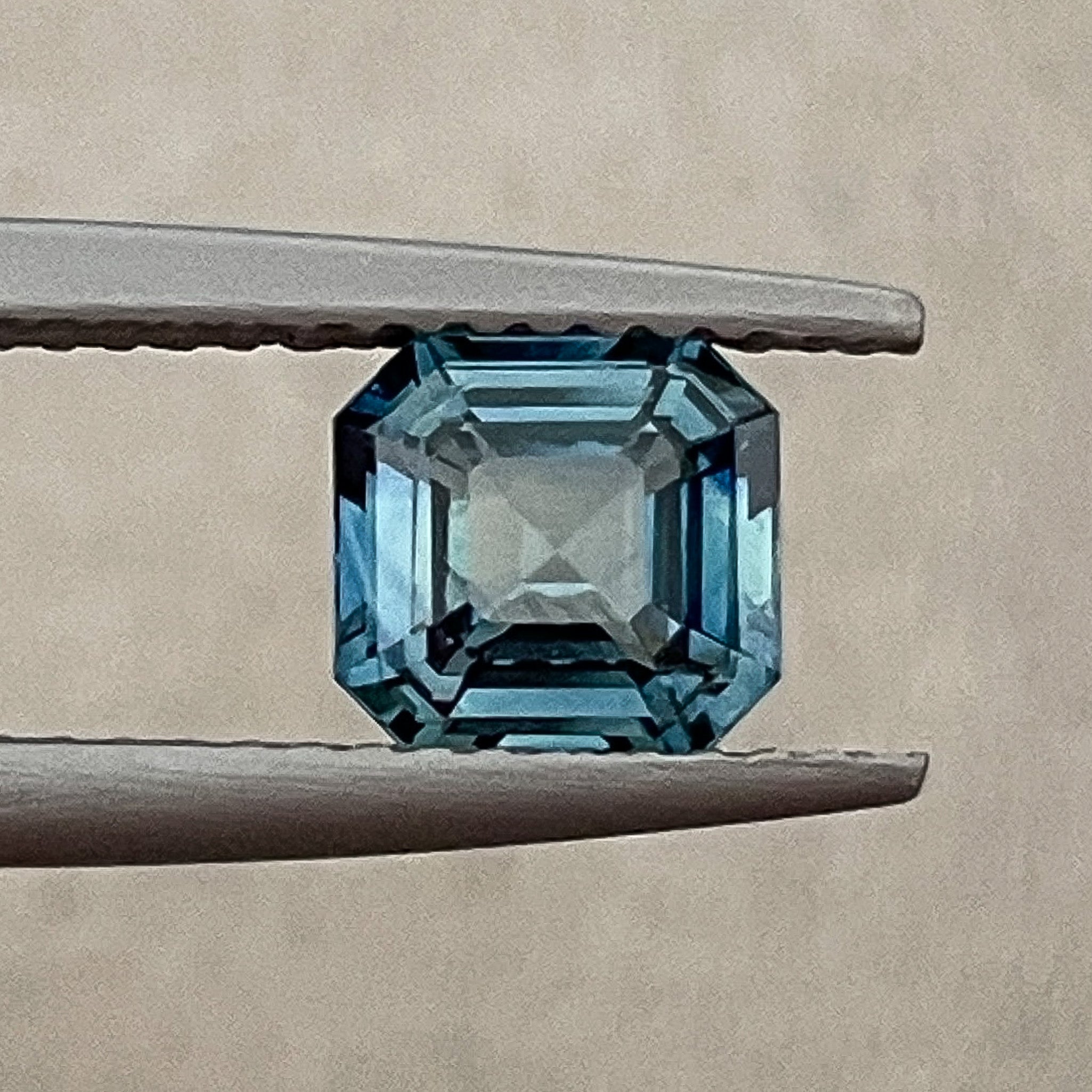 Natural teal blue sapphire 1.52 Ct emerald cut loose gemstone from NASHGEMS, perfect for engagement rings or custom jewelry designs.