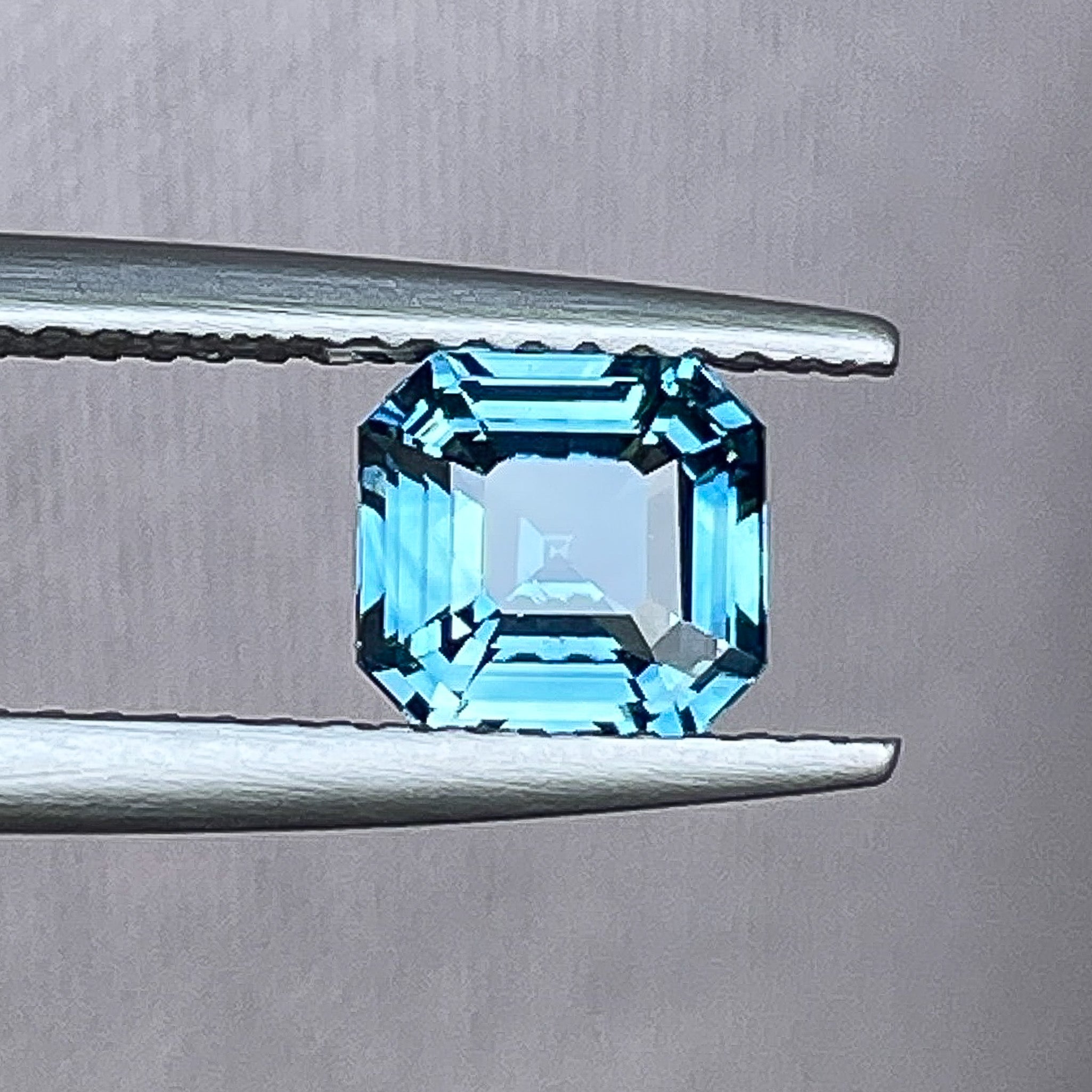 Natural teal blue sapphire 1.52 Ct emerald cut loose gemstone from NASHGEMS, perfect for engagement rings or custom jewelry.