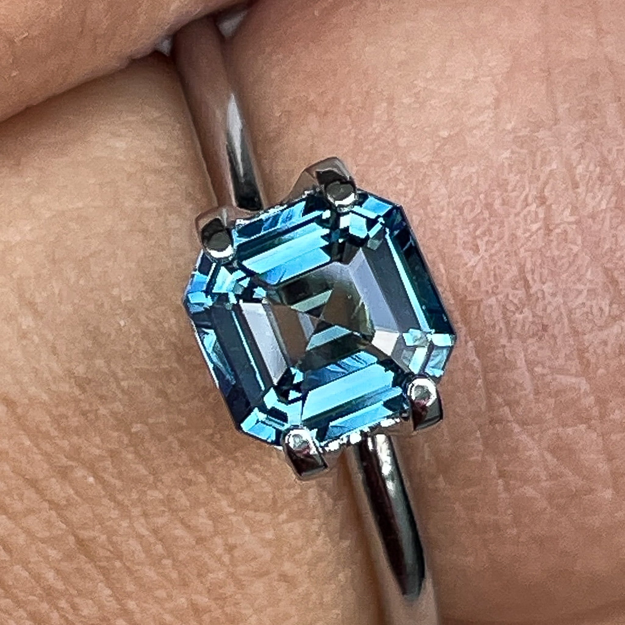 Natural teal blue sapphire 1.52 Ct emerald cut loose gemstone by NASHGEMS, perfect for engagement rings or custom jewelry.