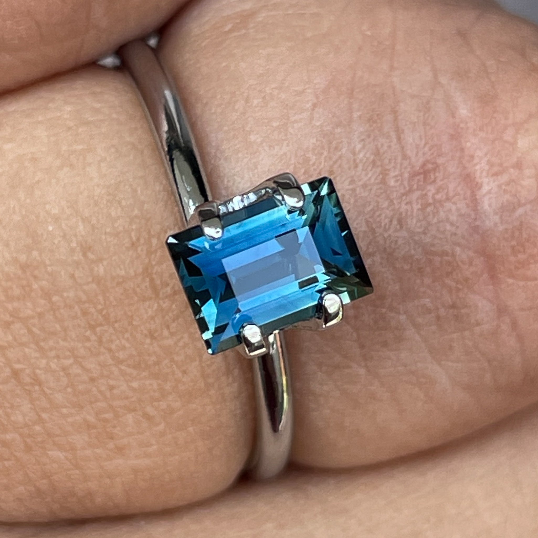 Natural teal blue sapphire 1.15 Ct loose baguette cut from NASHGEMS, ideal for engagement rings or custom jewelry designs.