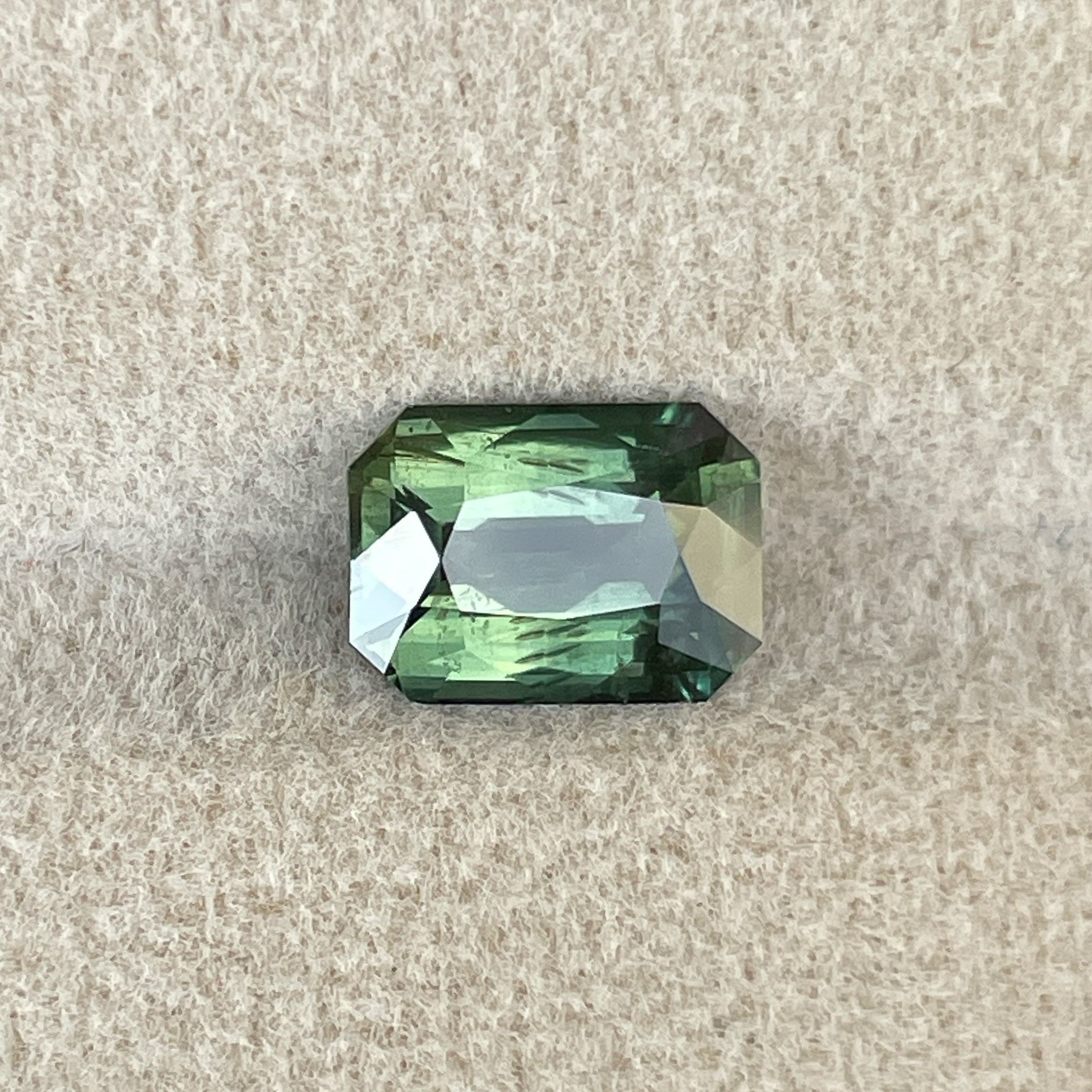 Natural green sapphire 2.36 ct radiant cut, teal gemstone by NASHGEMS, suitable for engagement rings or custom jewelry.
