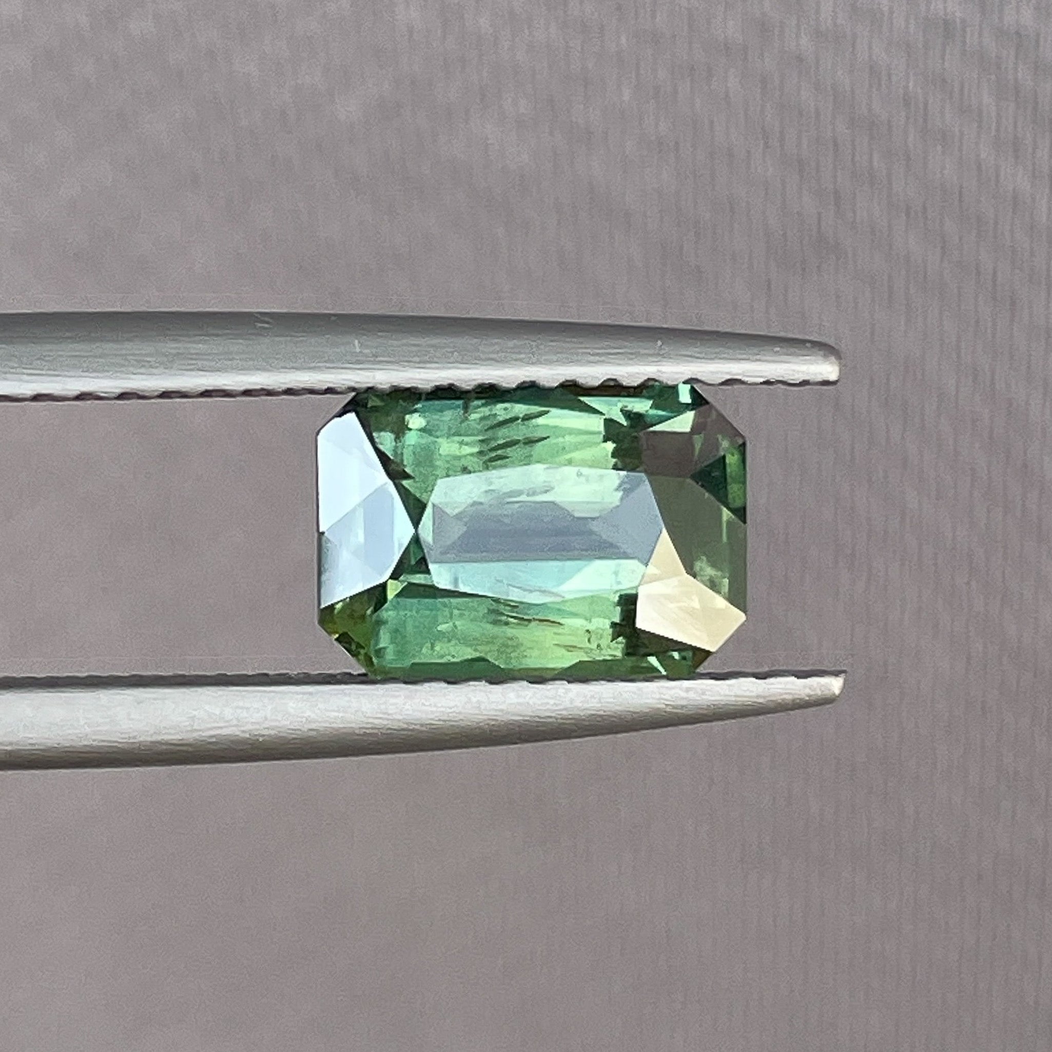 Teal green sapphire, 2.36 Ct radiant cut, heat-treated loose gemstone by NASHGEMS for engagement or custom jewelry.