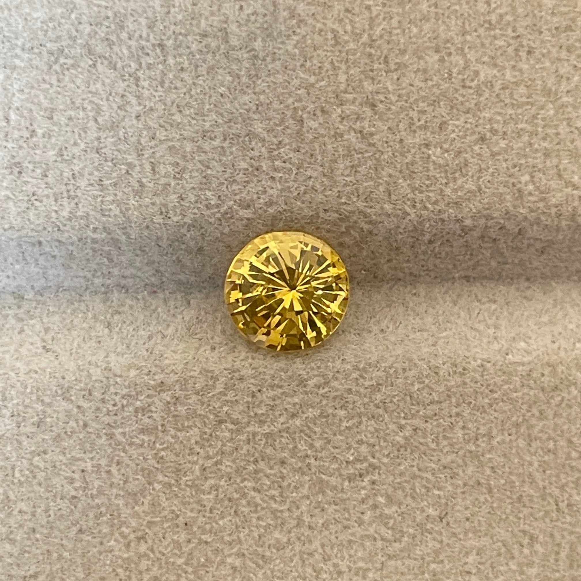 yellow round sapphire 1.58