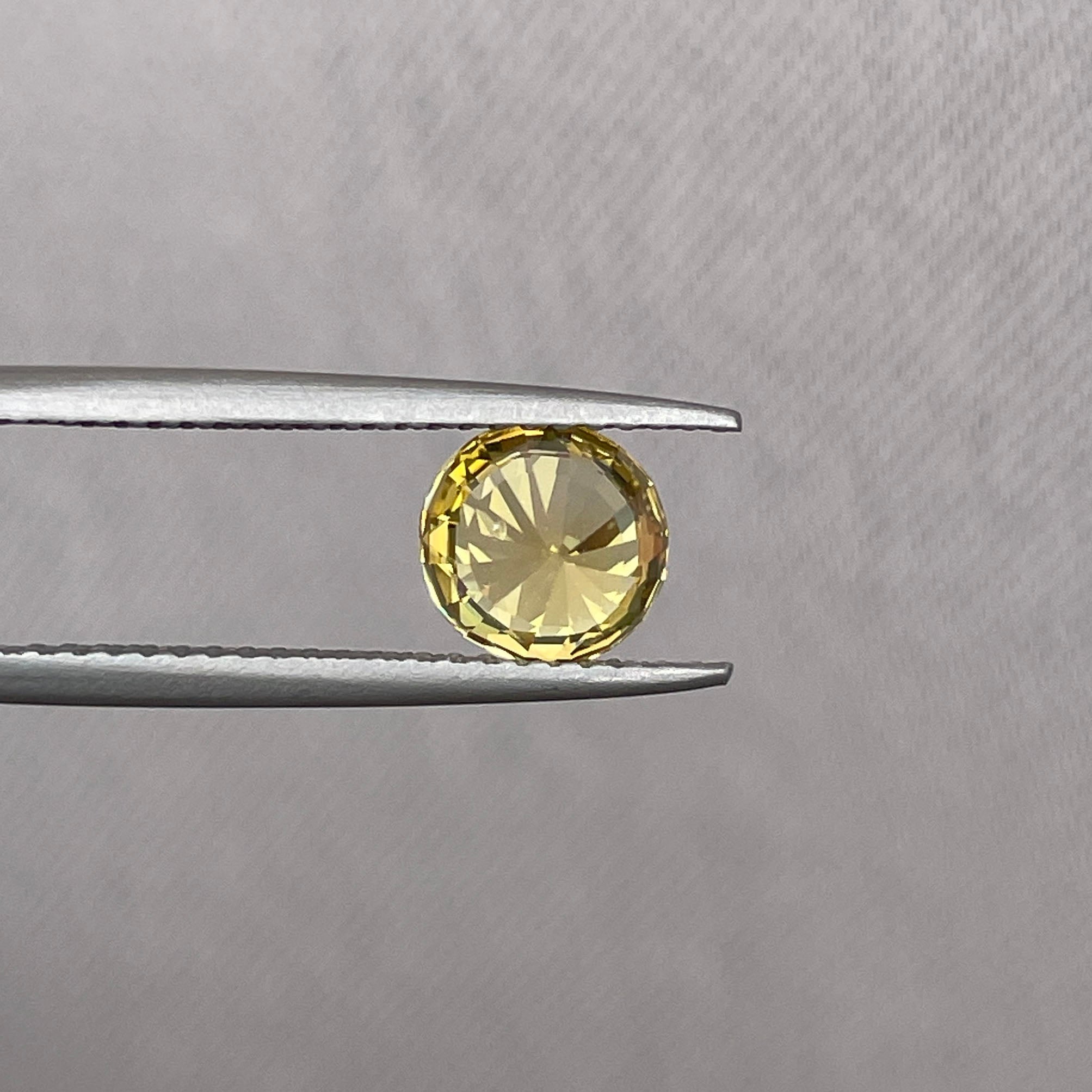 yellow round sapphire 1.58