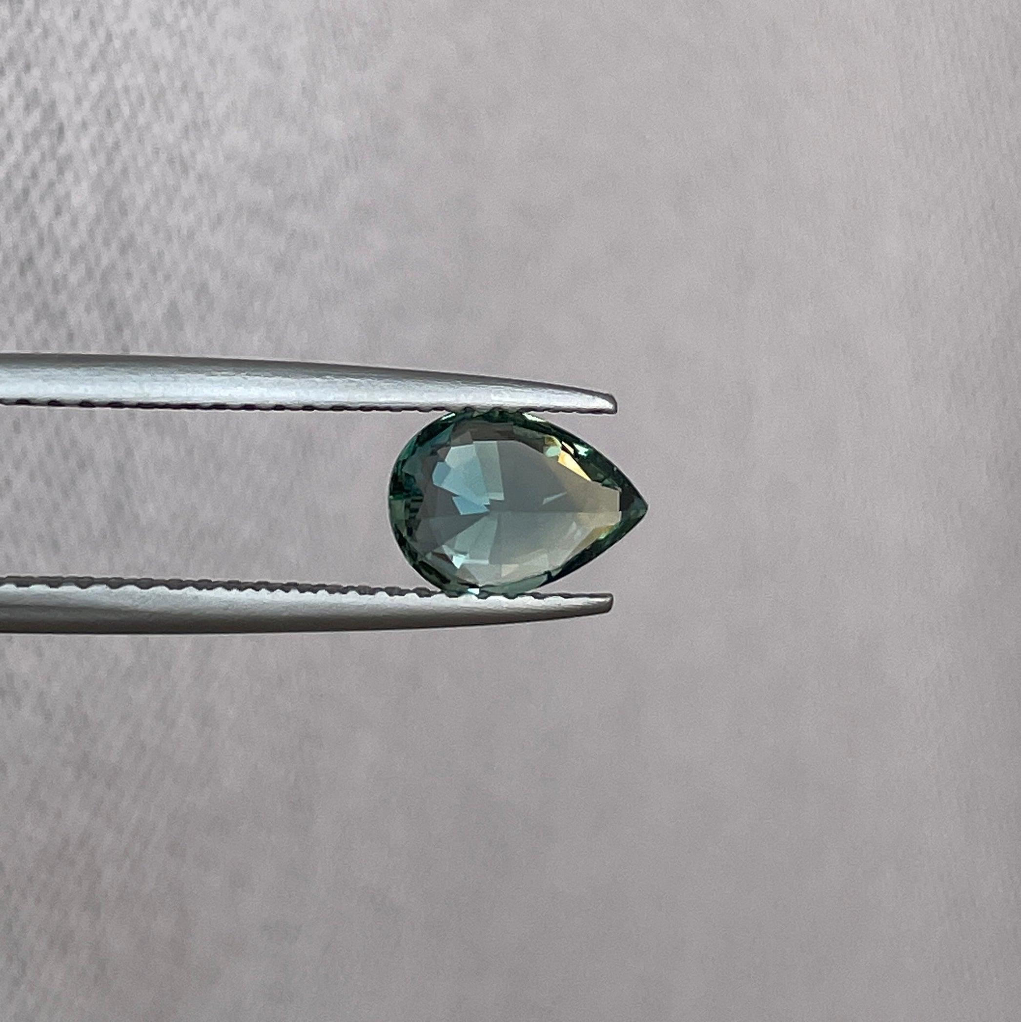 teal blue green parti sapphire pear drop cut gem