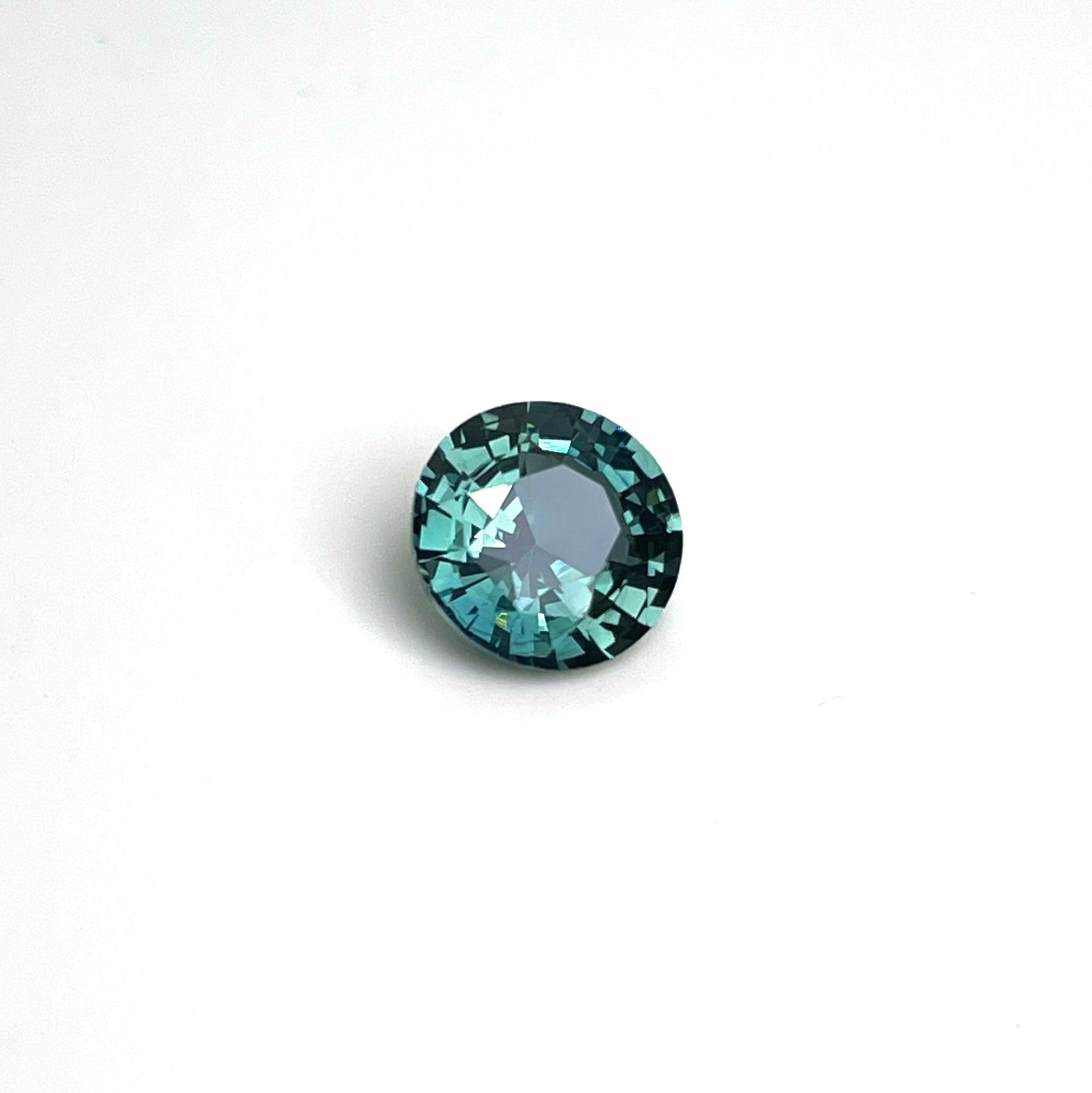 teal blue green parti sapphire round cut gem