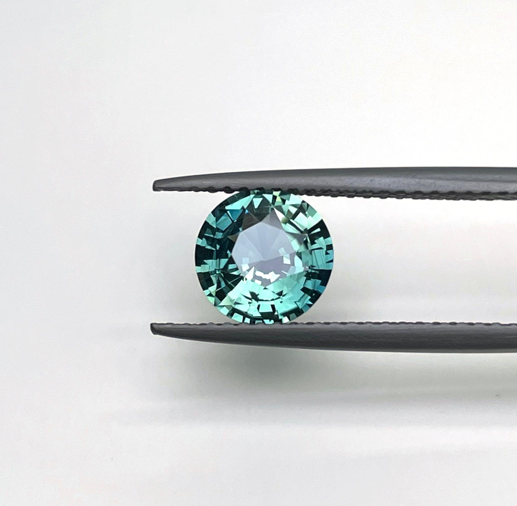 teal blue green parti sapphire round cut gem