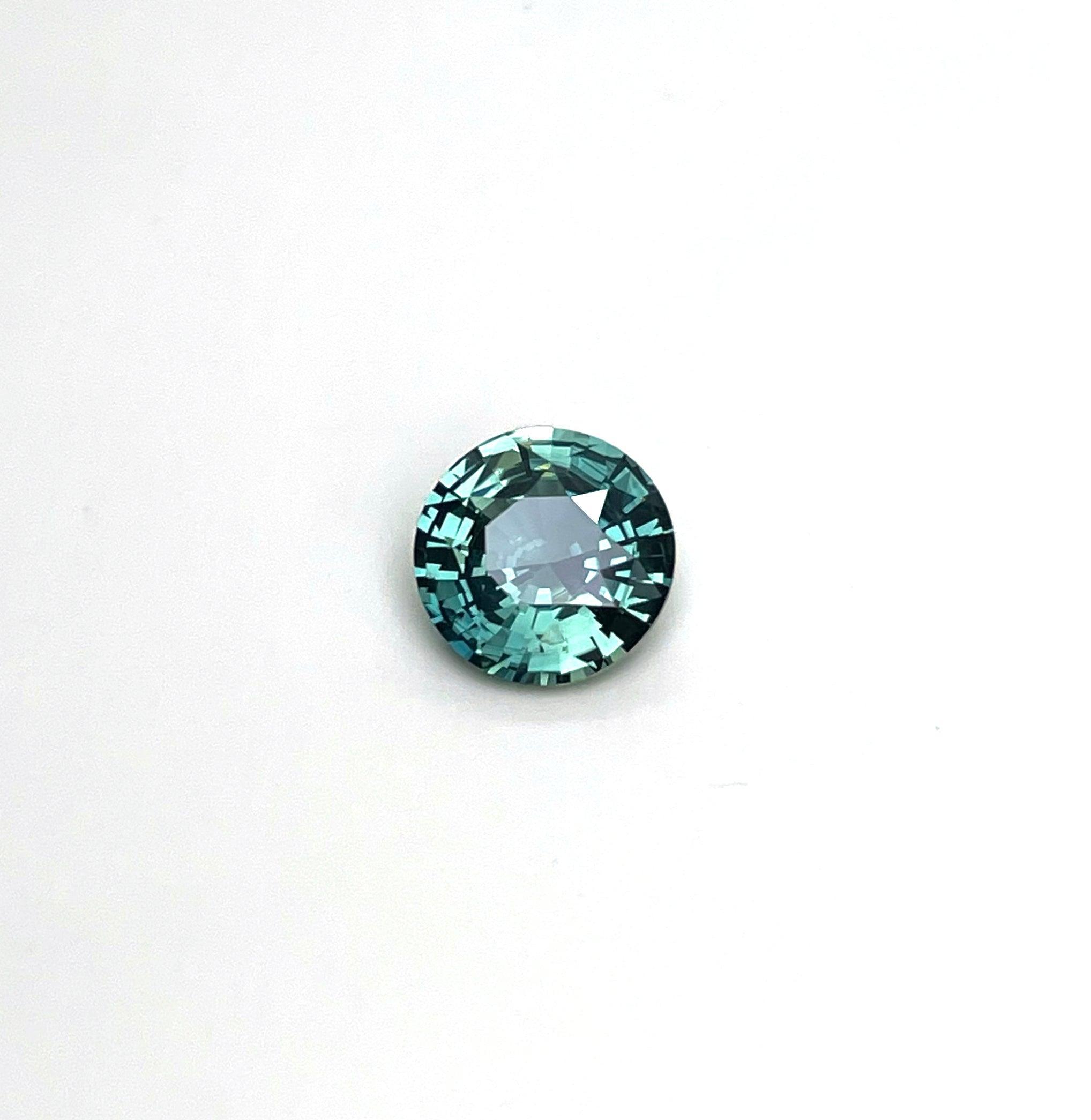 teal blue green parti sapphire round cut gem