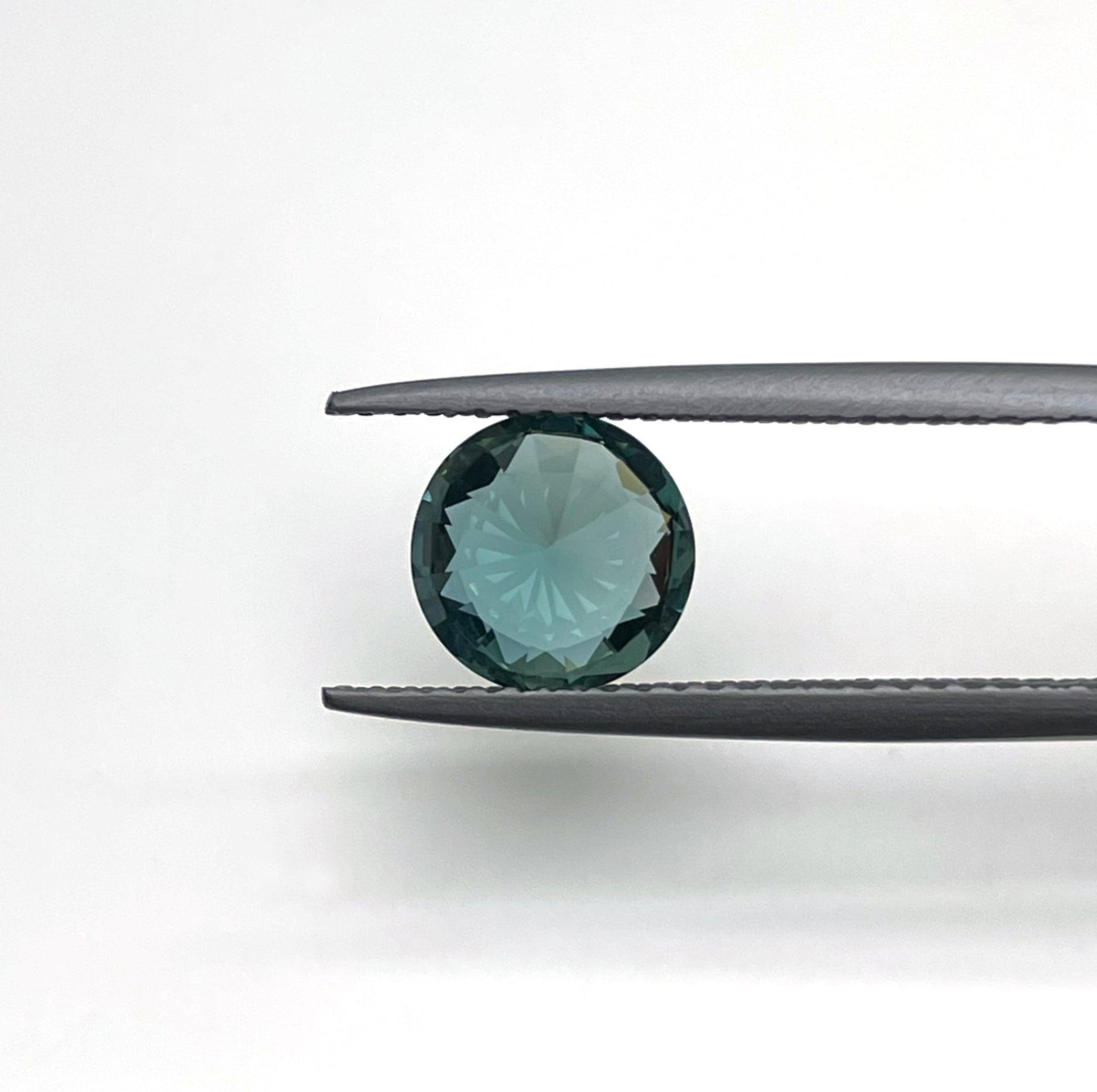 teal blue green parti sapphire round cut gem