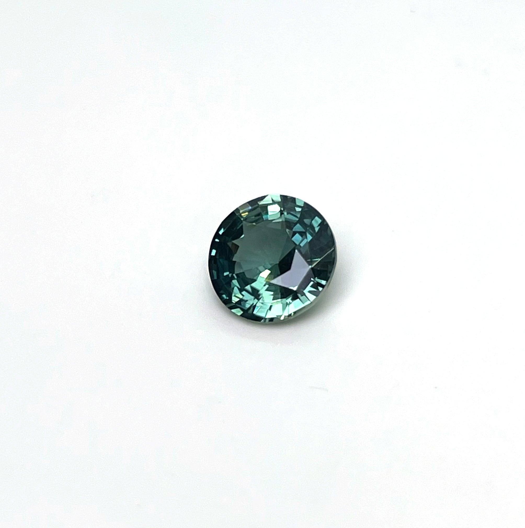 teal blue green parti sapphire round cut gem