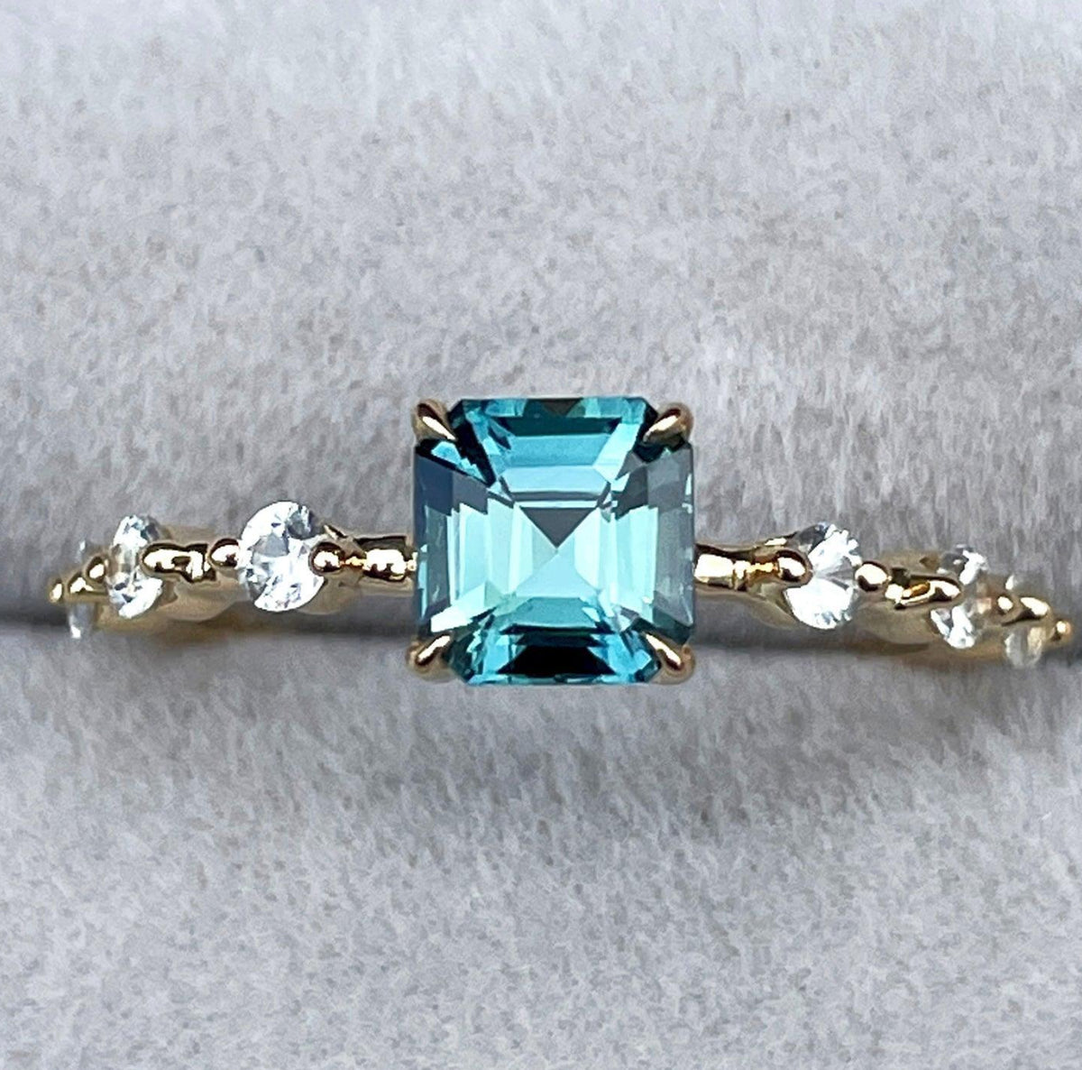 18k teal and green sapphire ring with 1.17 carats from NASHGEMS, showcasing a vibrant gemstone set in elegant design.