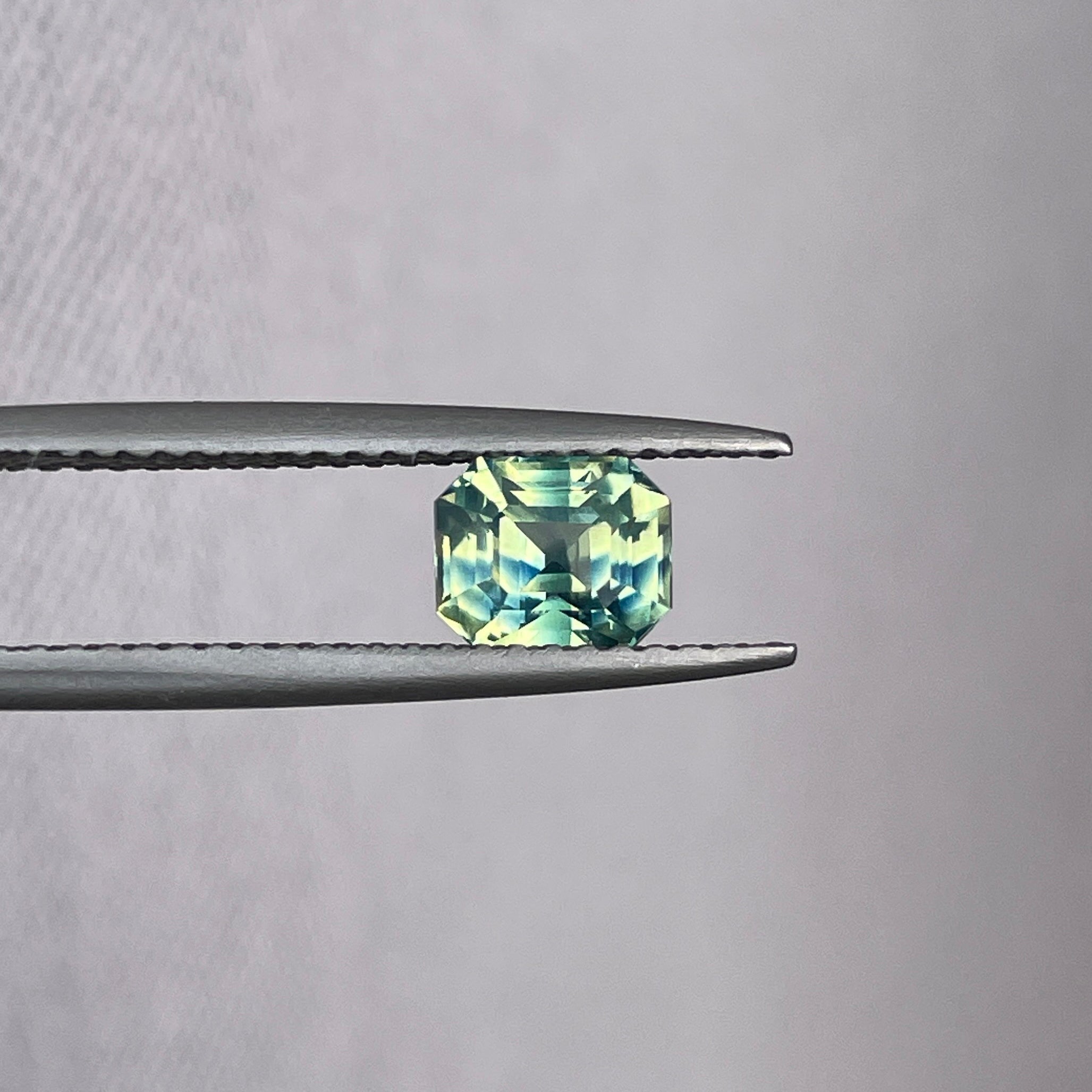 1.11 crt emerald cut parti sapphire
