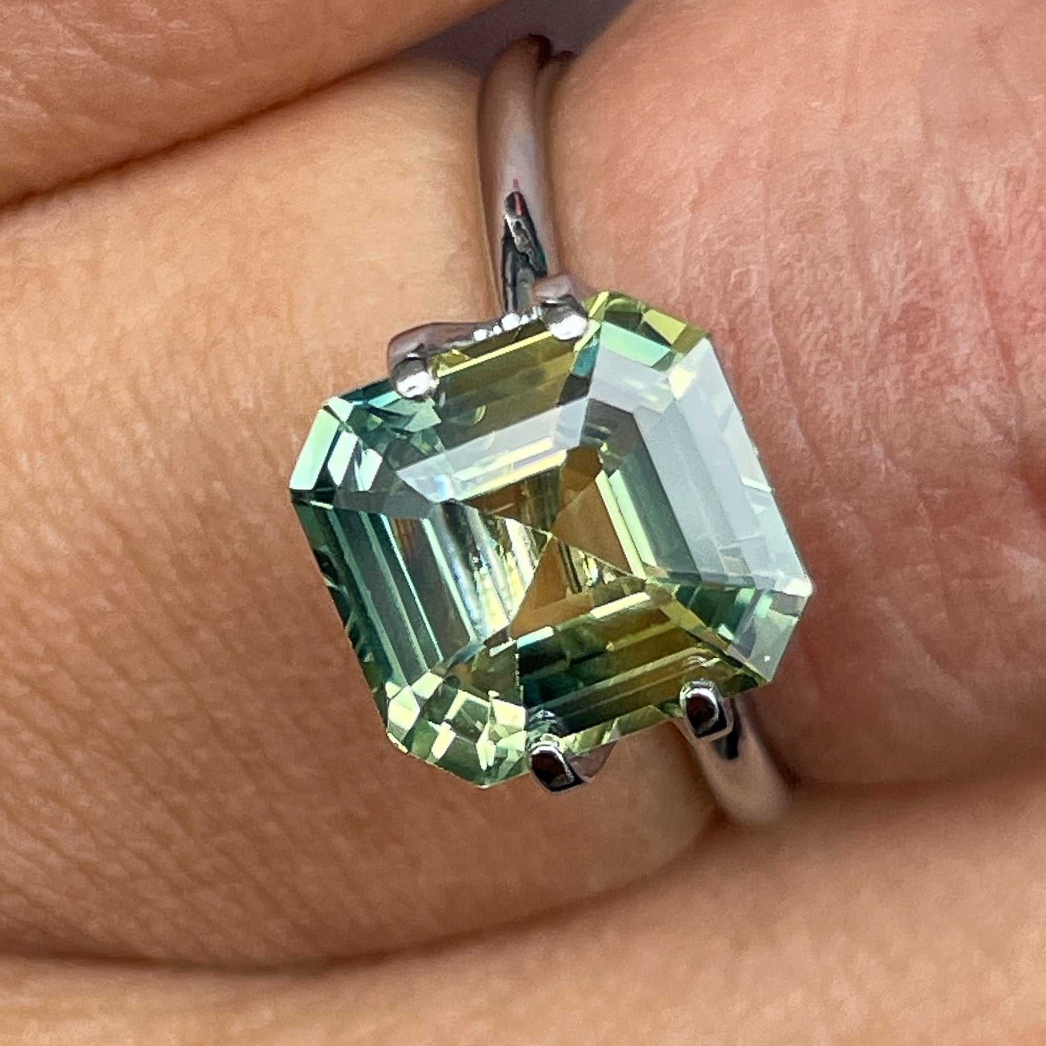 Teal parti sapphire, 4.02 Ct Asscher emerald cut, bi-color green-yellow loose gemstone from NASHGEMS for custom engagement rings.