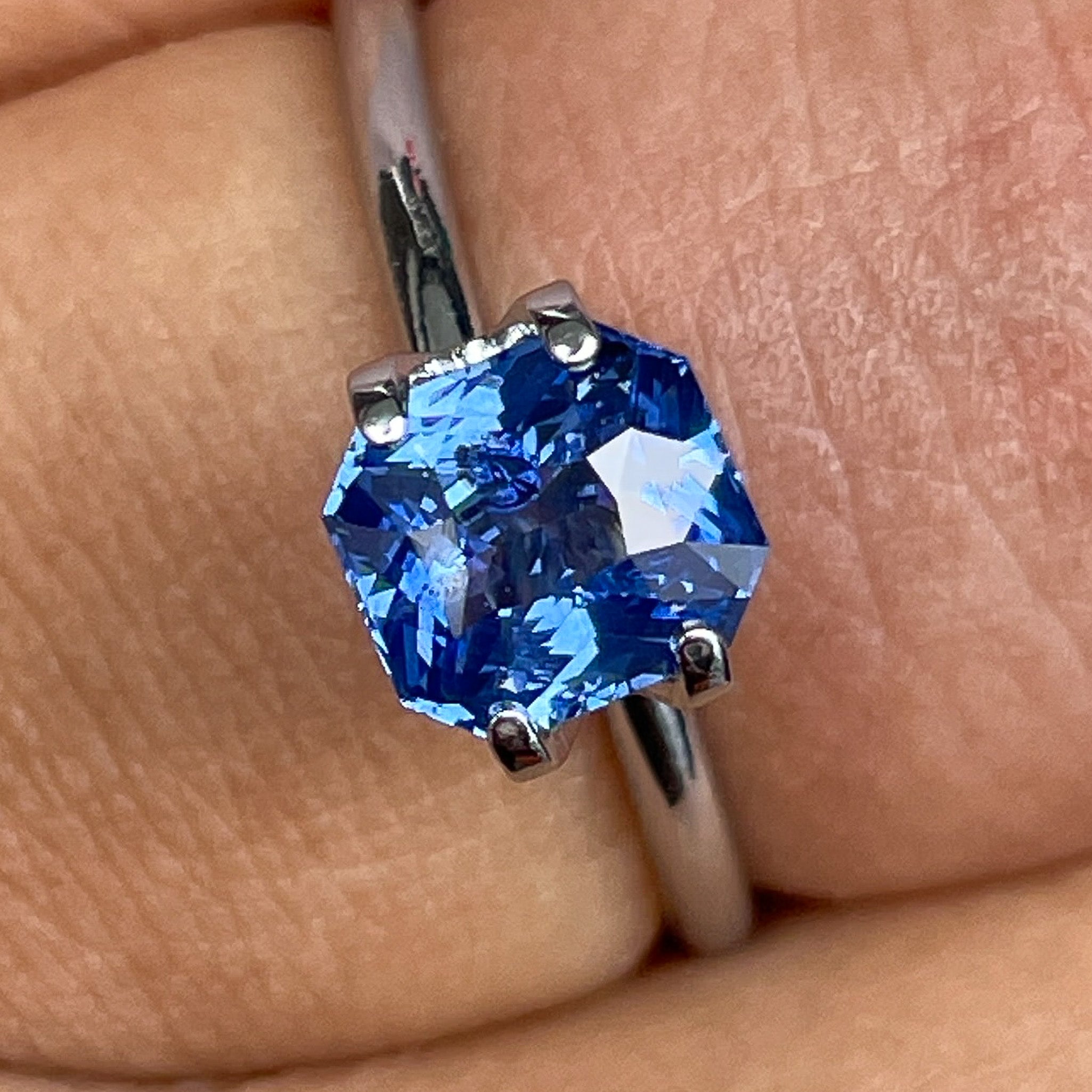 Natural Ceylon blue sapphire 1.52 ct radiant cut loose gemstone by NASHGEMS, vivid blue color ideal for jewelry or engagement rings.