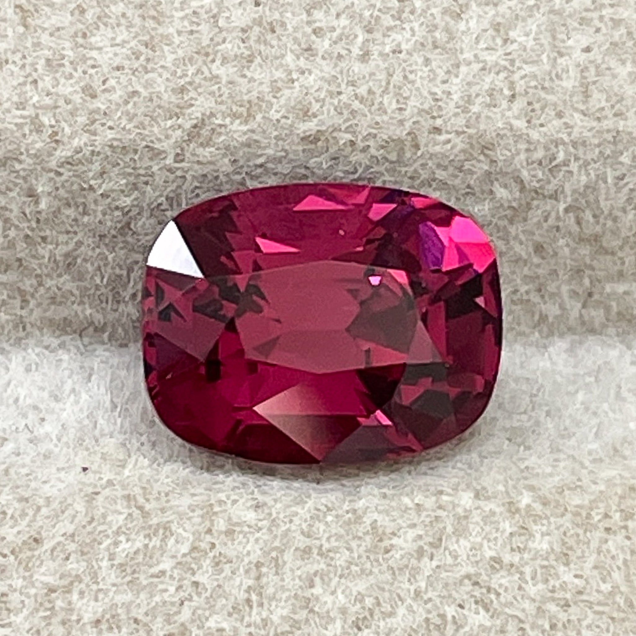 Natural Rhodolite Garnet 2.14 Ct cushion cut gemstone with raspberry red hue, VVS clarity, ideal for engagement rings.