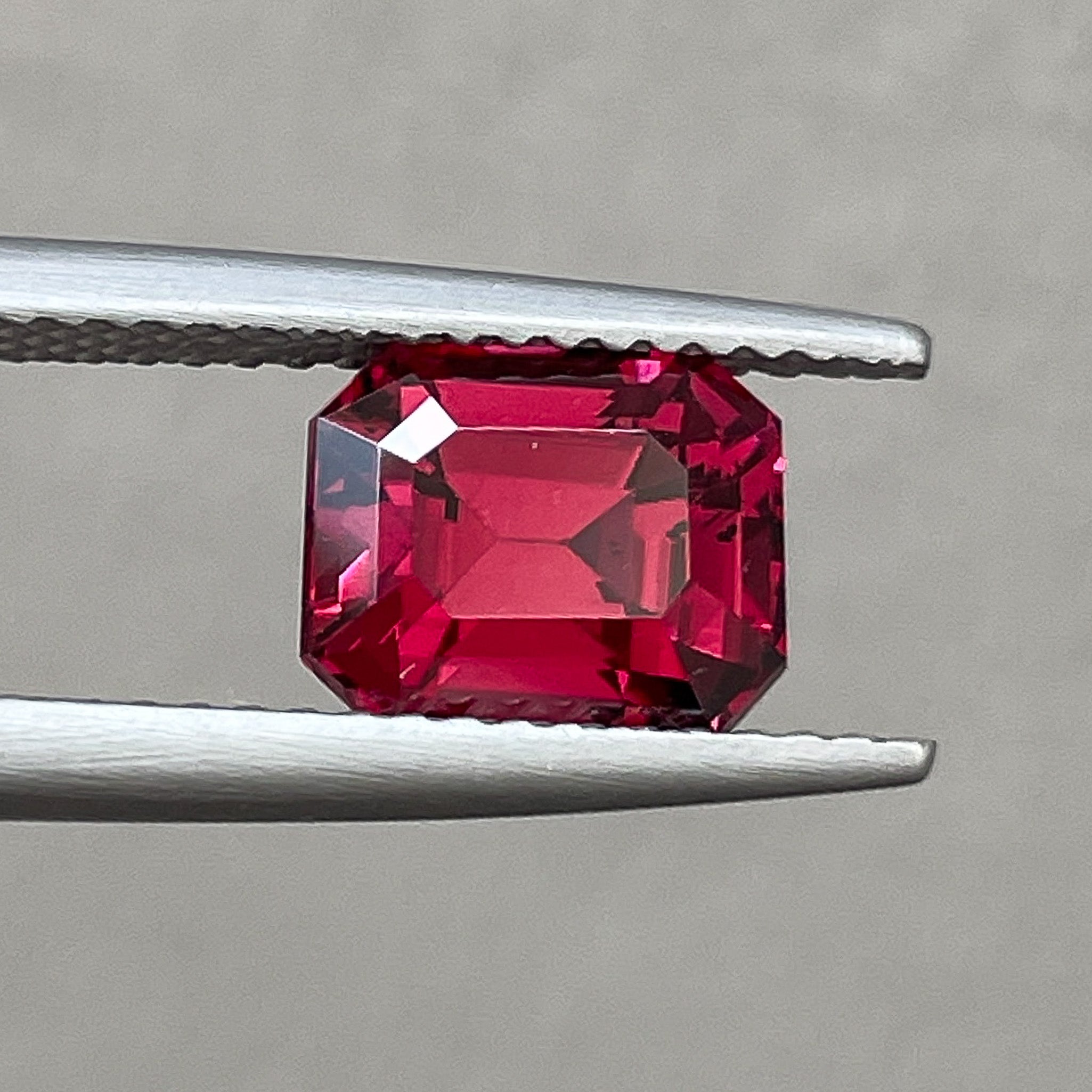 Natural Pyrope Almandite Garnet 2.73 ct emerald cut loose gemstone with deep red color for engagement rings.