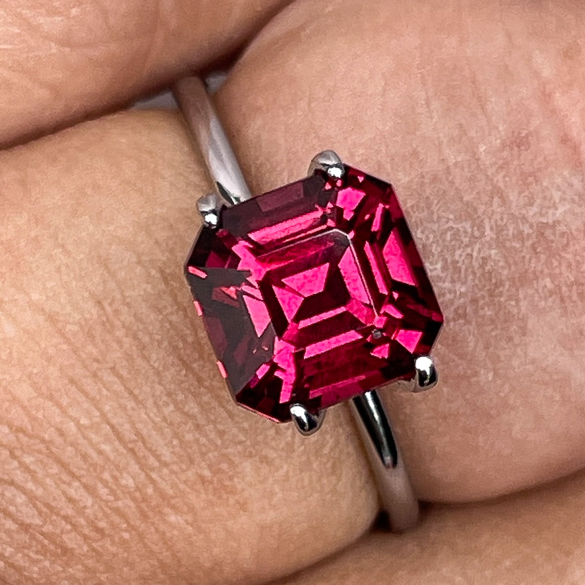 Natural Pyrope Almandite Garnet 3.12 Ct emerald cut loose gemstone in deep red for jewelry or engagement rings.