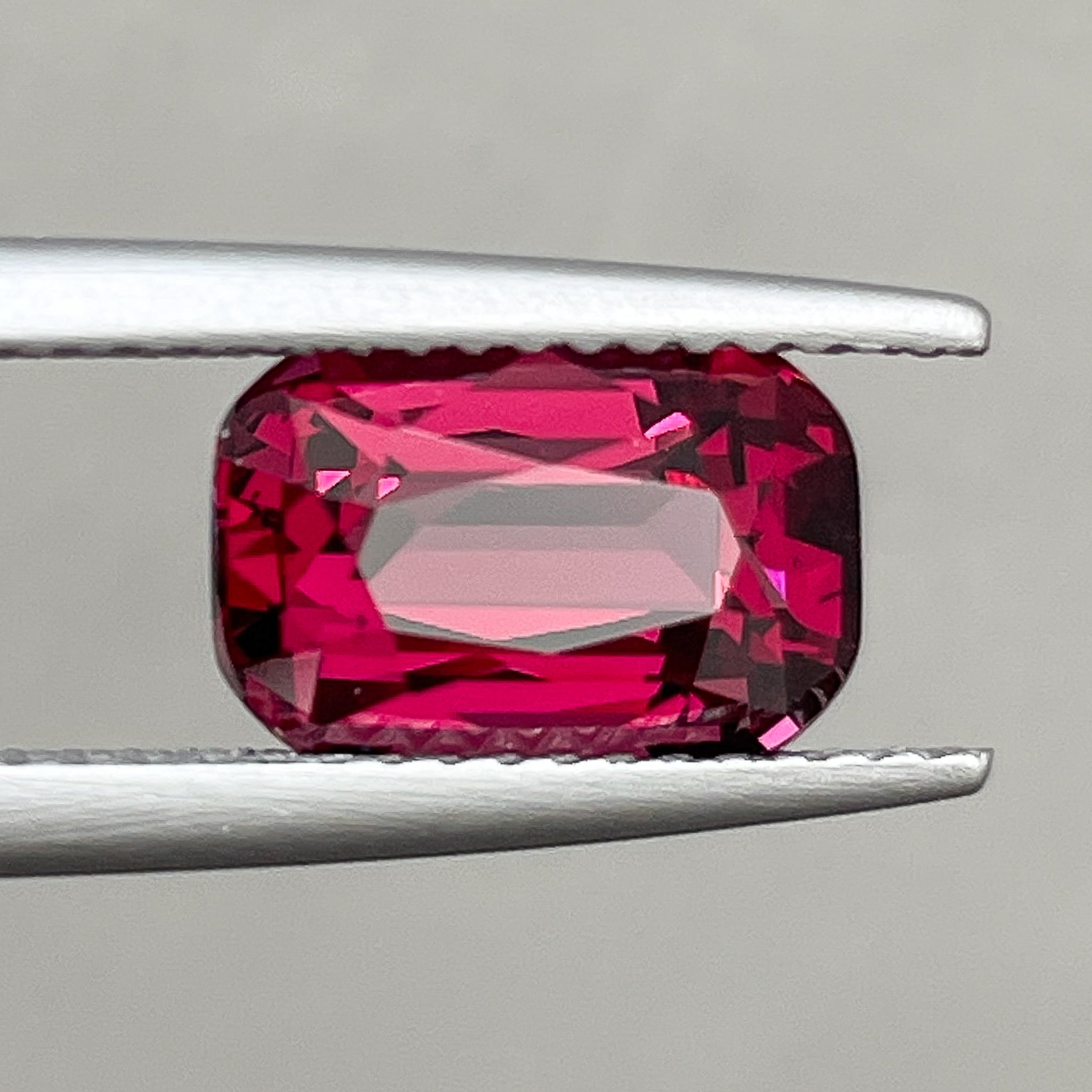Natural Rhodolite Garnet 3.18 Ct cushion cut loose gemstone in raspberry red, ideal for engagement rings by NASHGEMS.