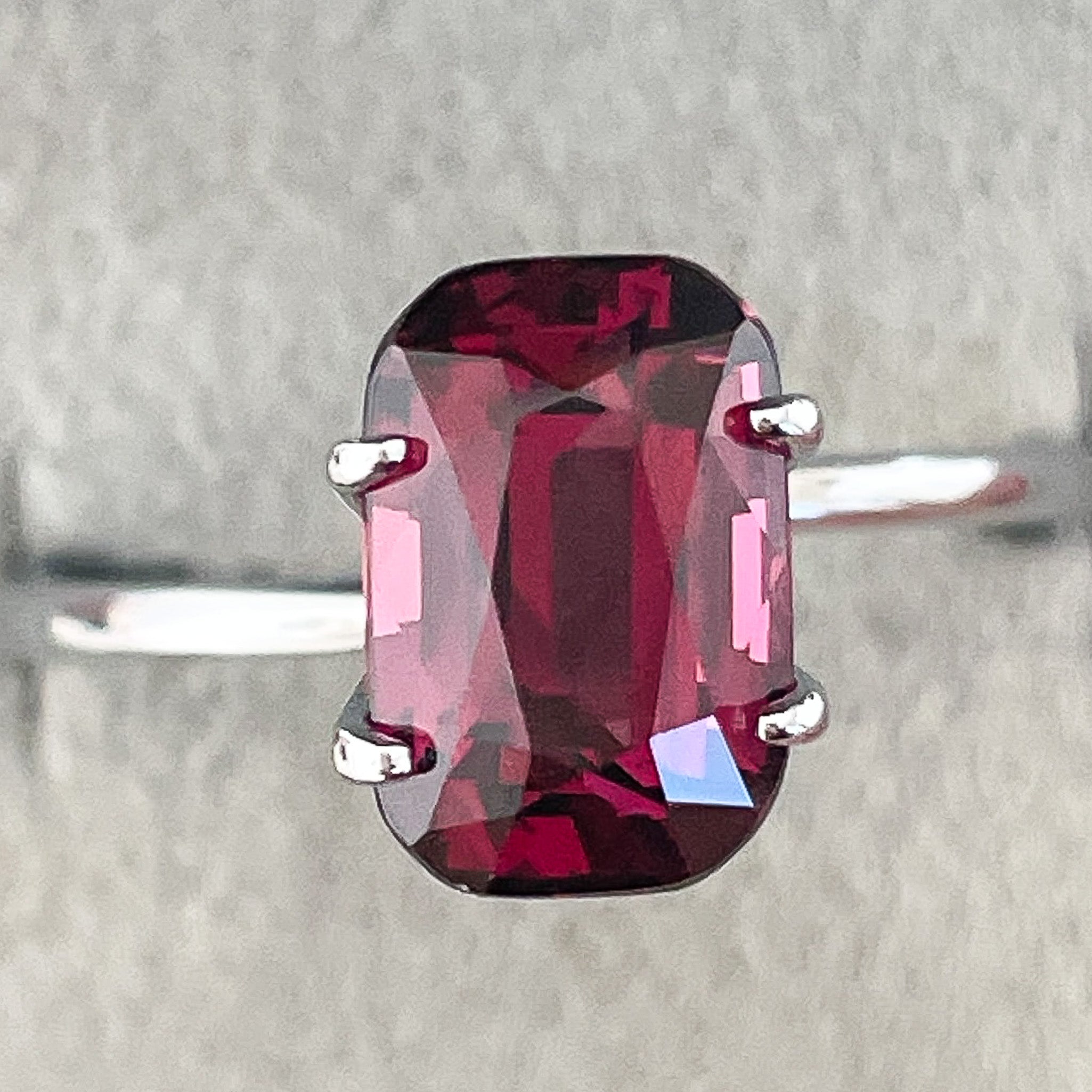 Natural Rhodolite Garnet 3.18 Ct cushion cut gemstone with raspberry red color, VVS clarity, ideal for engagement jewelry.