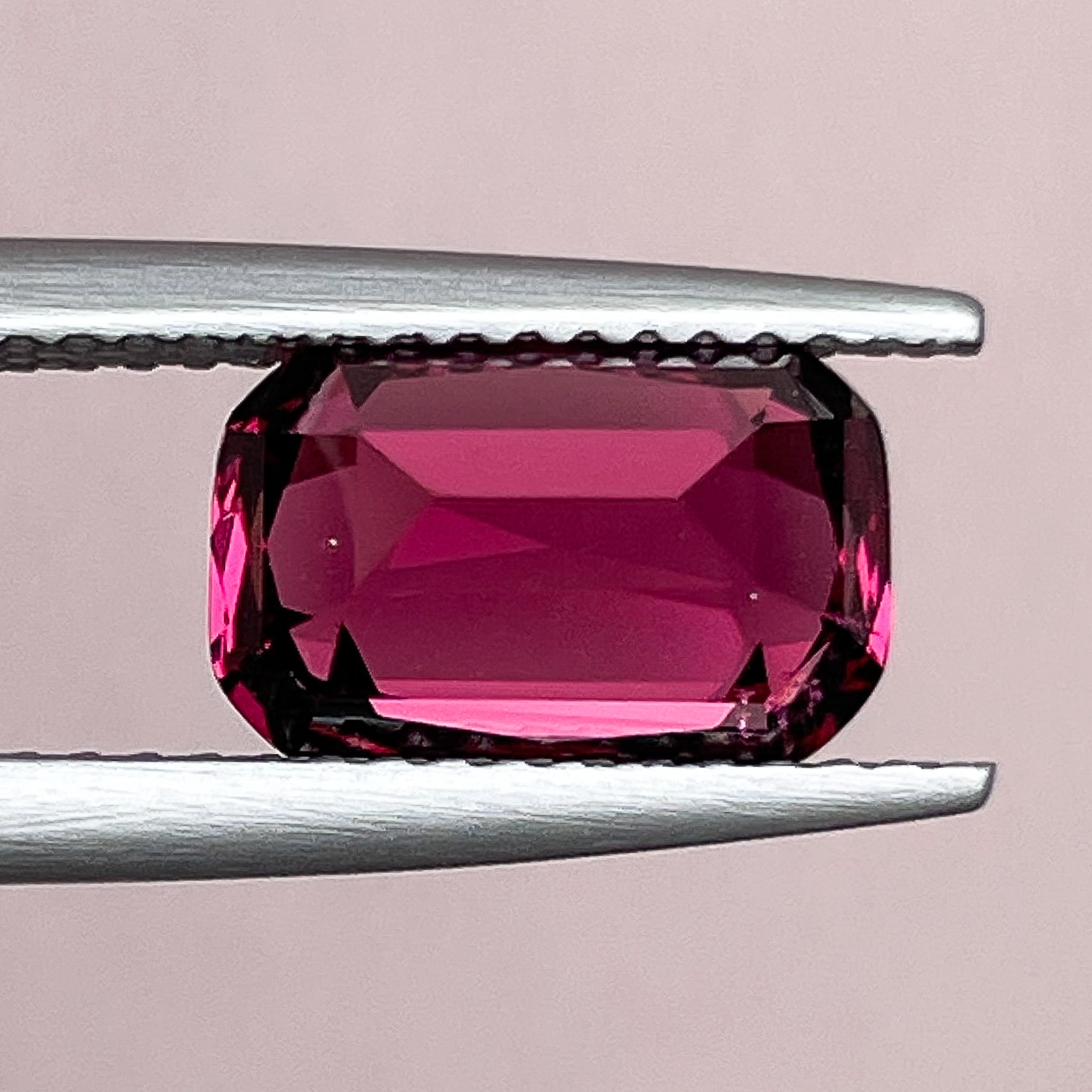 Natural Rhodolite Garnet 3.18 Ct cushion cut gemstone with raspberry red color, VVS clarity, perfect for engagement rings.
