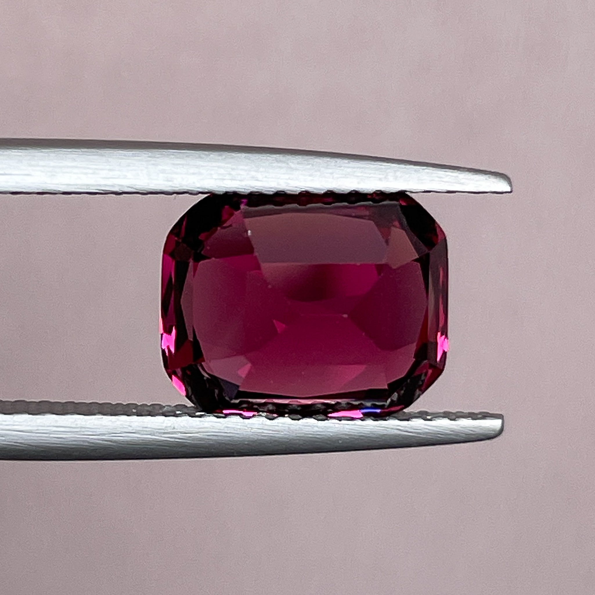 Natural Rhodolite Garnet 4.53 Ct cushion cut gemstone in raspberry red for engagement rings, VVS clarity, from NASHGEMS.