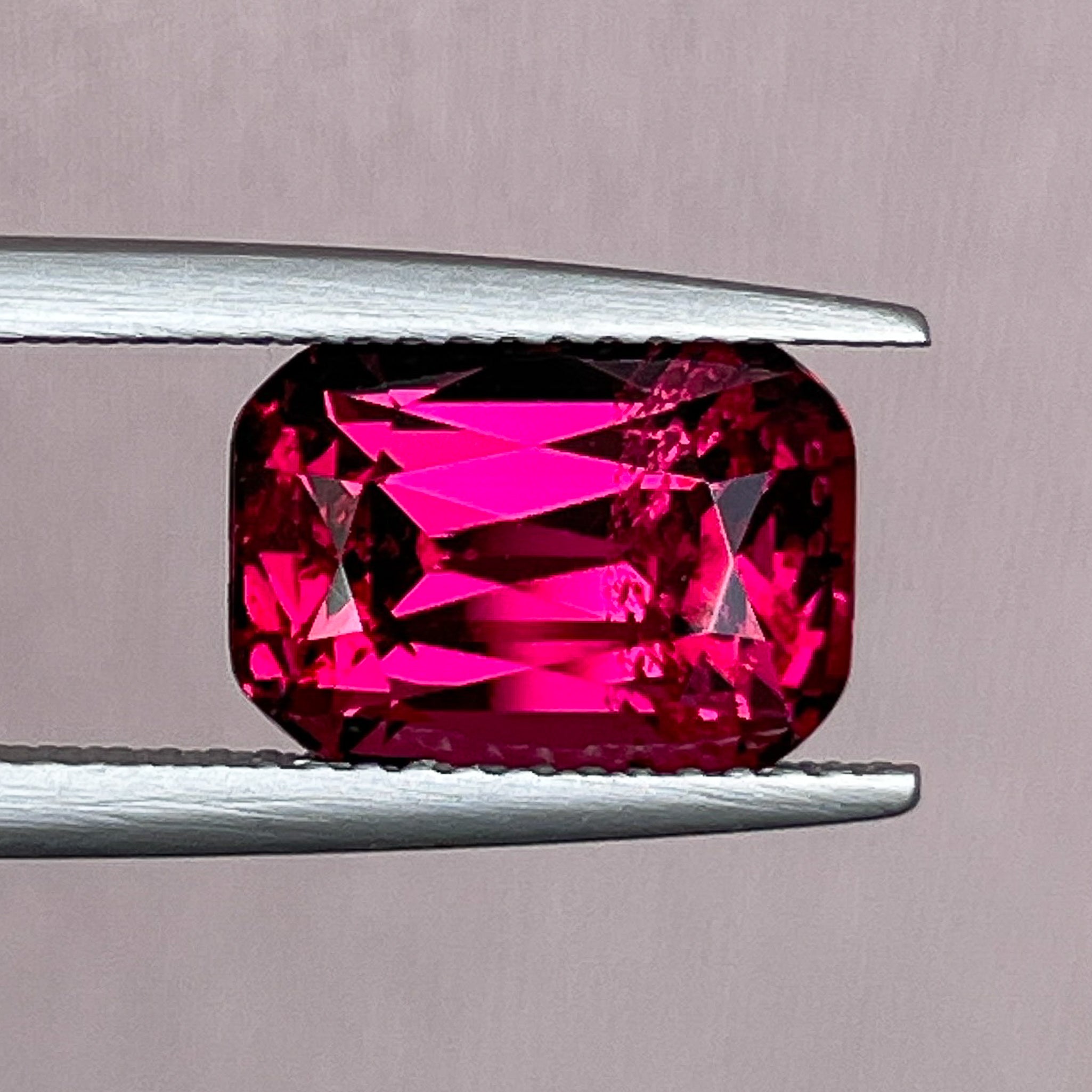 Natural Rhodolite Garnet 5.00 ct cushion cut loose gemstone in raspberry red, ideal for engagement rings from NASHGEMS.